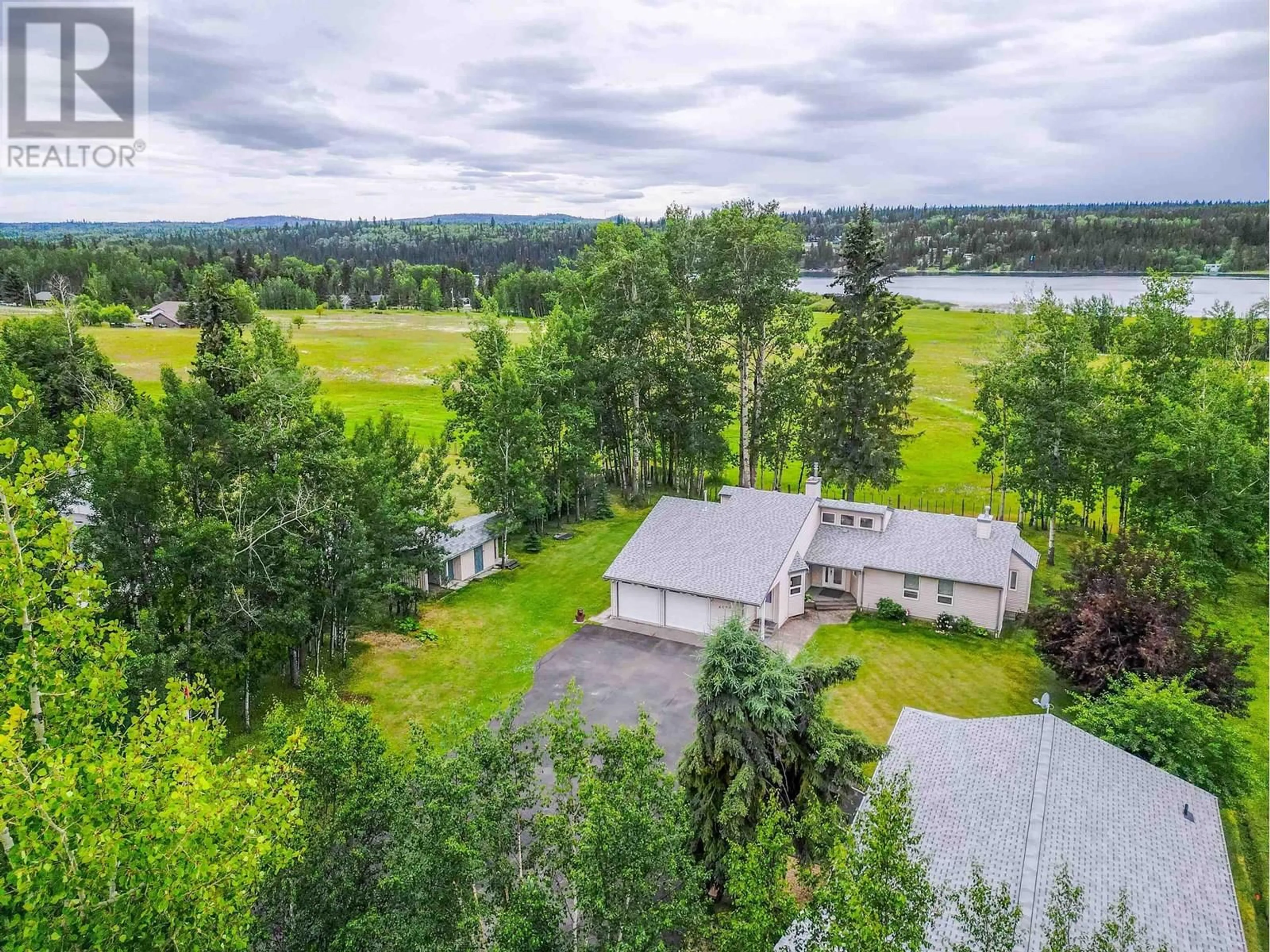 A pic from outside/outdoor area/front of a property/back of a property/a pic from drone, water/lake/river/ocean view for 6092 LAKESHORE DRIVE, Horse Lake British Columbia V0K2E3
