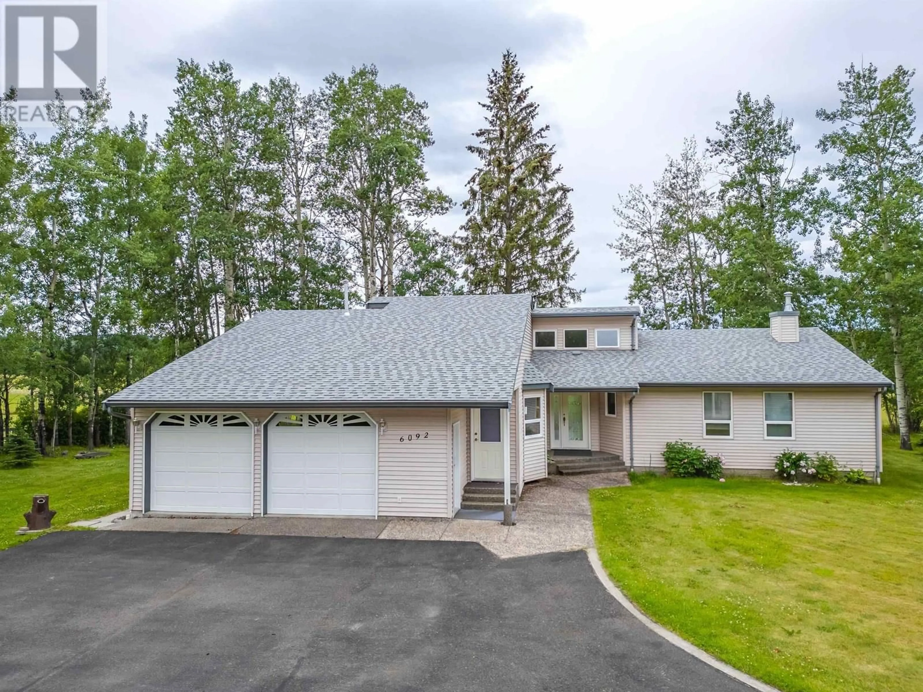 A pic from outside/outdoor area/front of a property/back of a property/a pic from drone, street for 6092 LAKESHORE DRIVE, Horse Lake British Columbia V0K2E3
