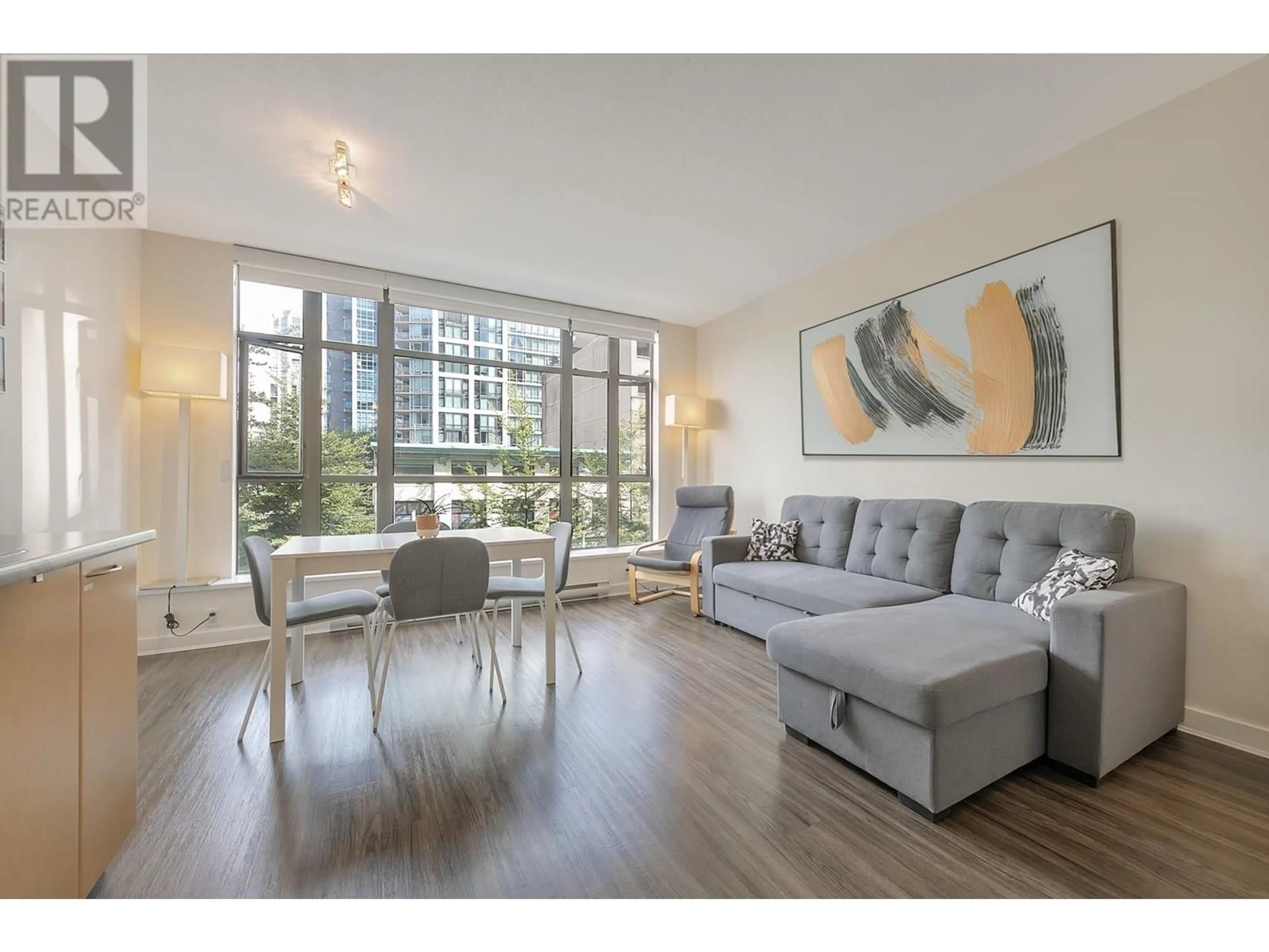Living room with furniture, wood/laminate floor for 307 - 1249 GRANVILLE STREET, Vancouver British Columbia V6Z1M5