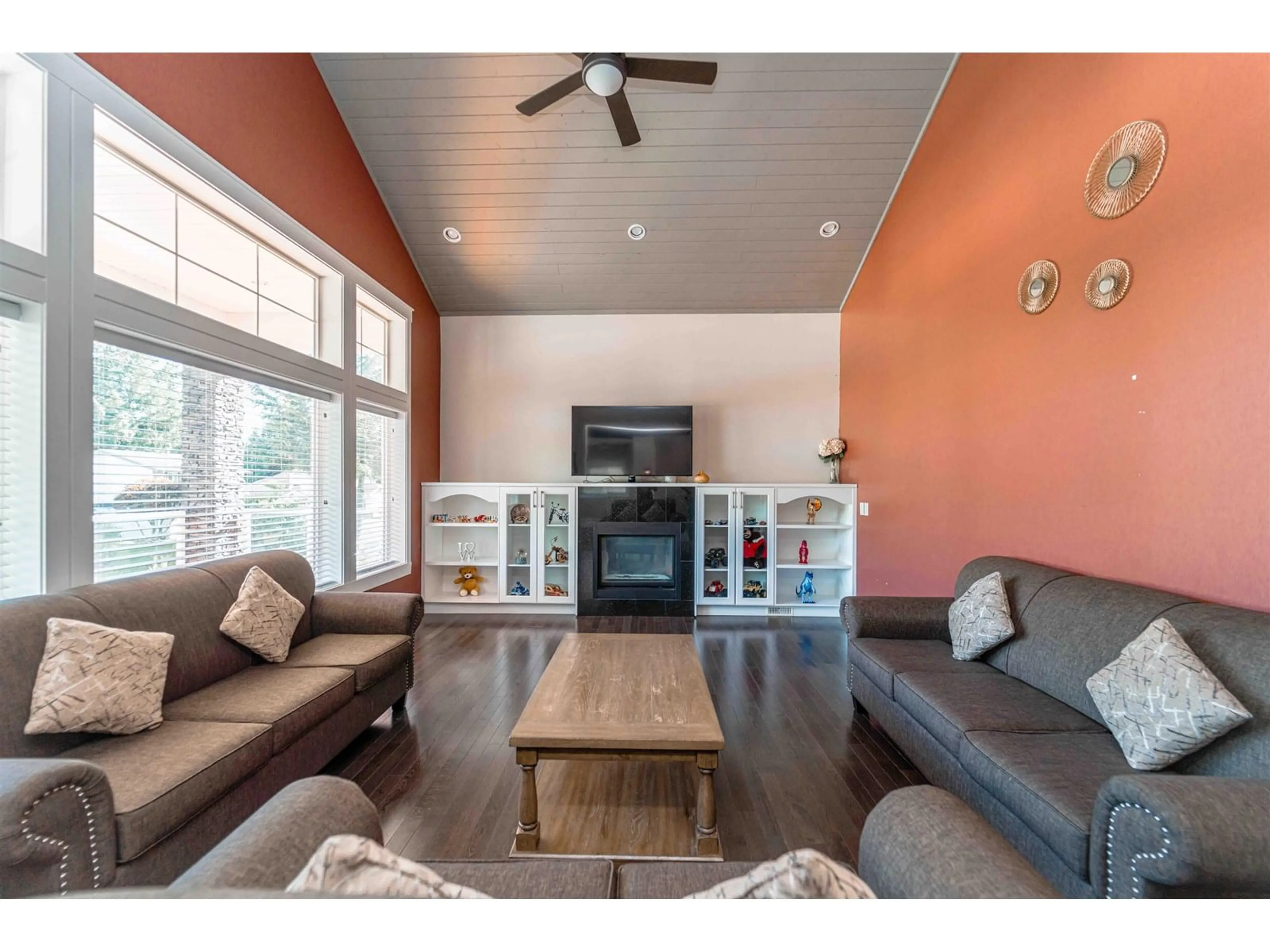 Living room with furniture, wood/laminate floor for 34931 MT. BLANCHARD, Abbotsford British Columbia V2S6N5