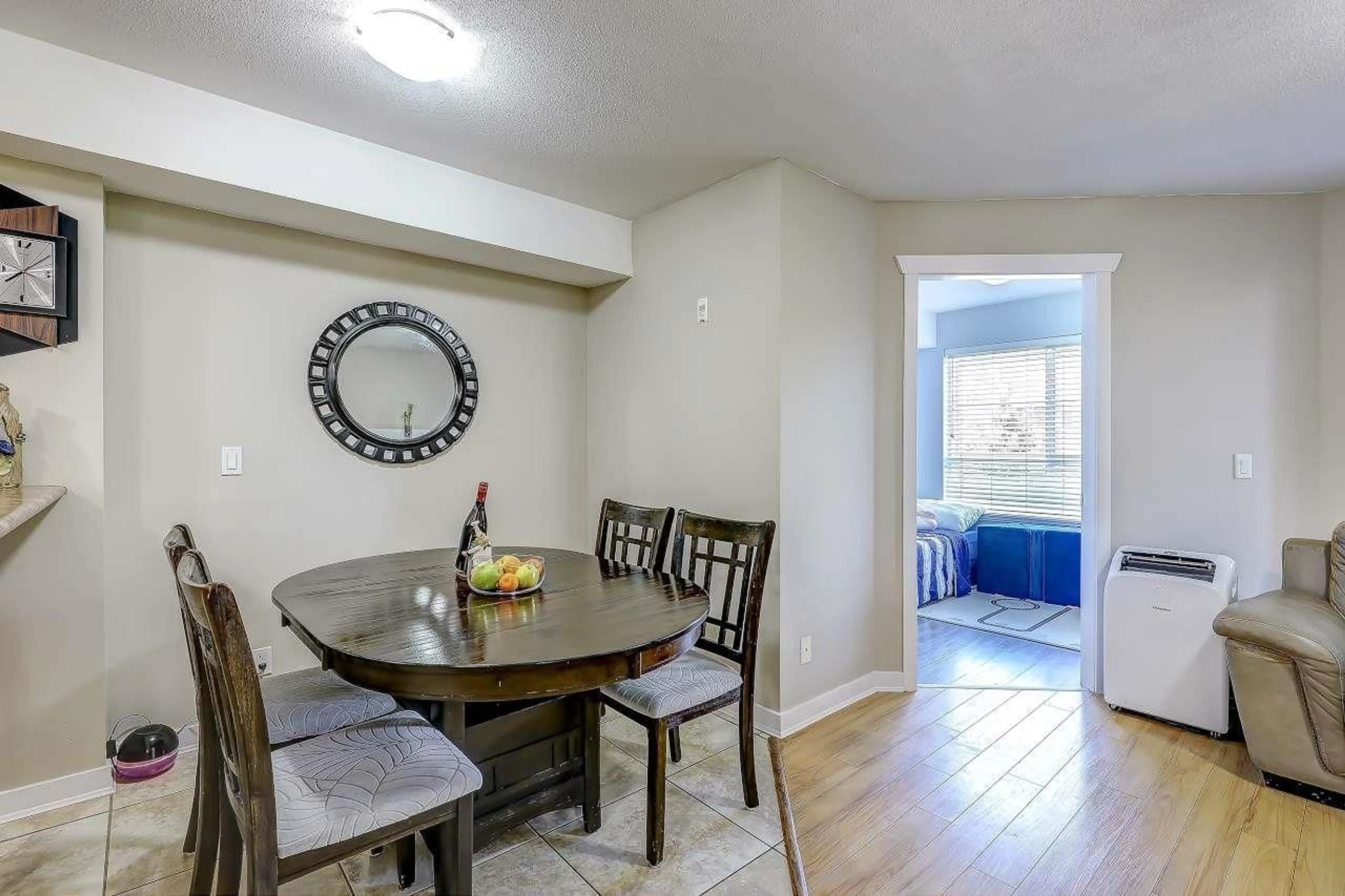 Dining room, wood/laminate floor for 213 - 6960 120, Surrey British Columbia V3W1V4