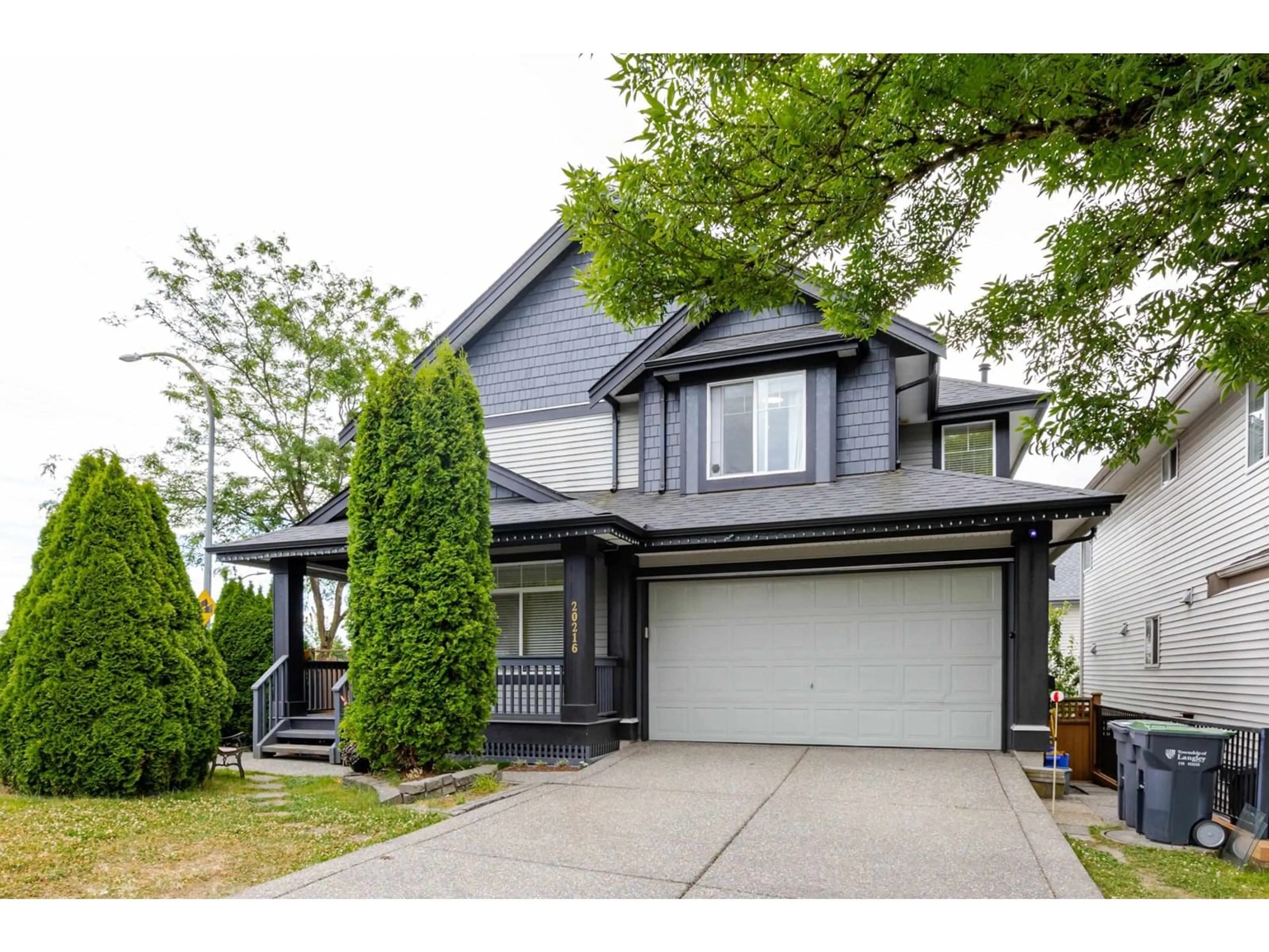 Home with vinyl exterior material, street for 20216 70A, Langley British Columbia V2Y2Y6