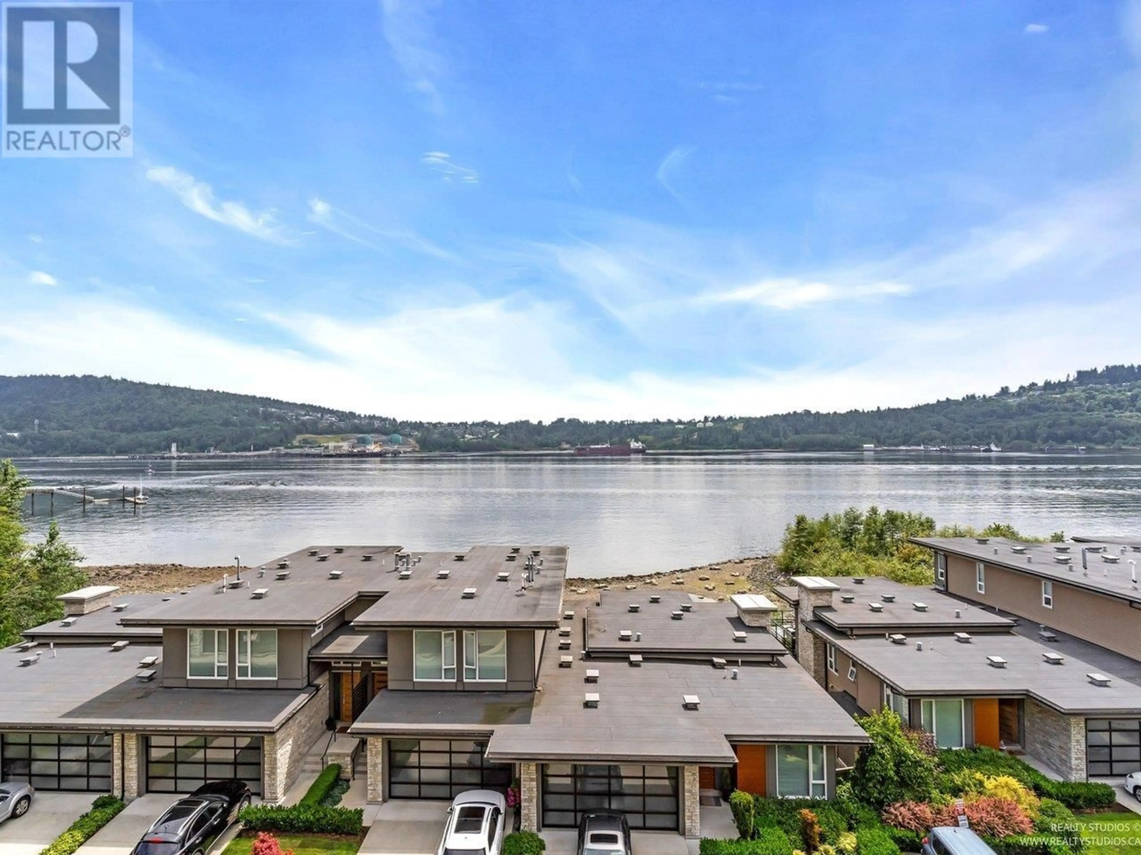 A pic from outside/outdoor area/front of a property/back of a property/a pic from drone, water/lake/river/ocean view for 401 - 3911 CATES LANDING WAY, North Vancouver British Columbia V7G0A6