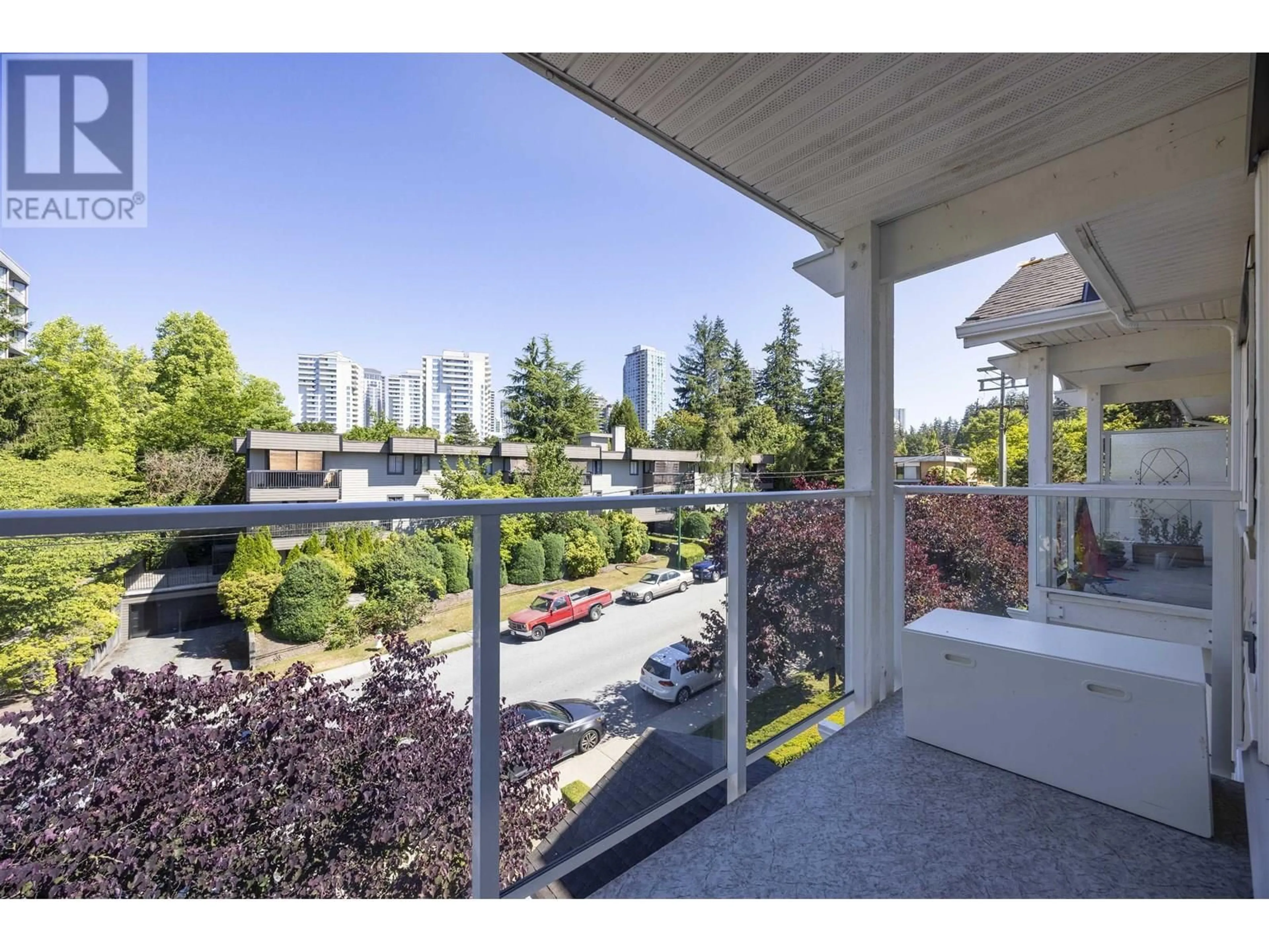 Patio, city buildings view from balcony for 310 - 5655 INMAN AVENUE, Burnaby British Columbia V5H2M2