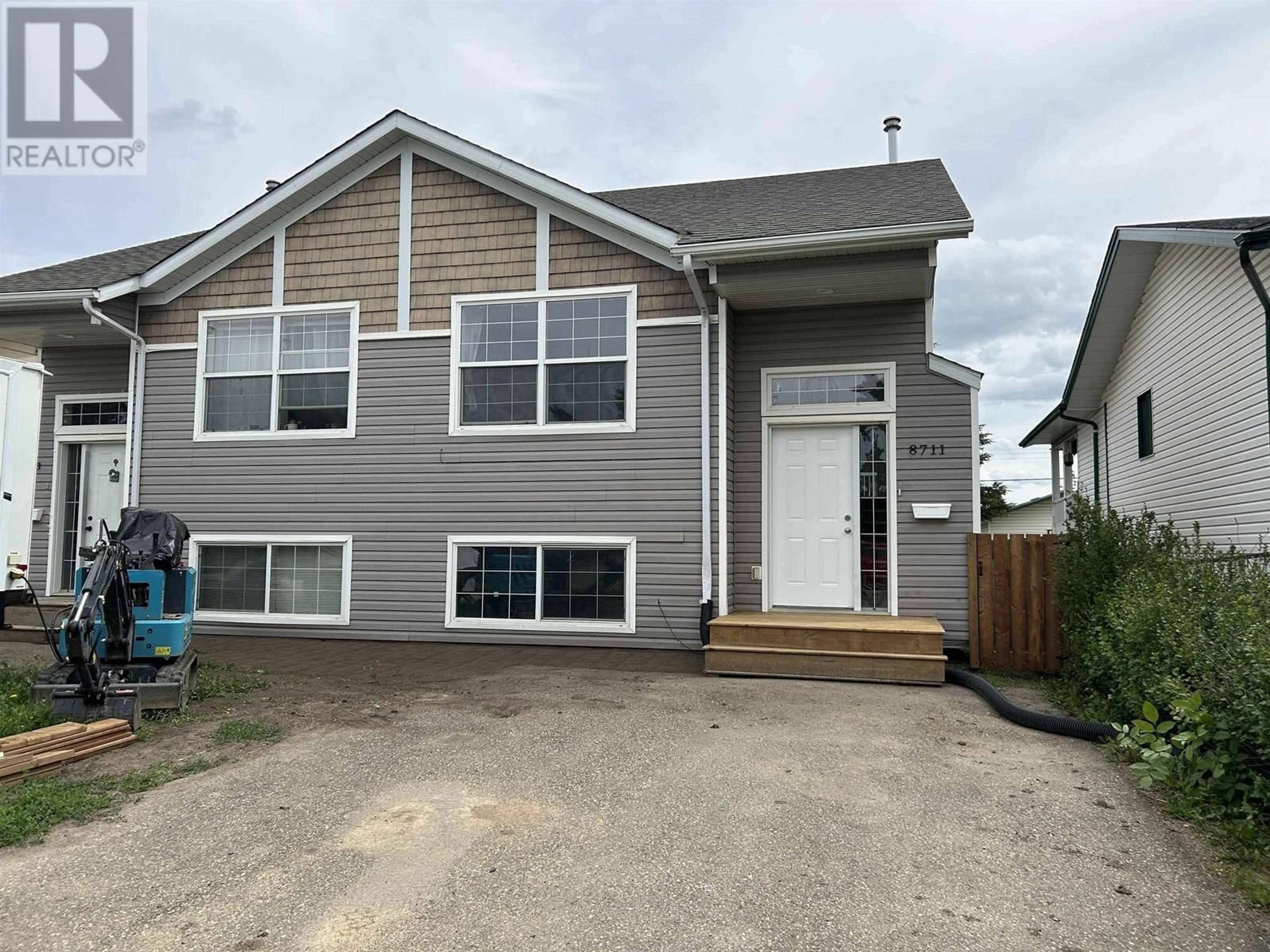Home with vinyl exterior material, street for 8711 78A STREET, Fort St. John British Columbia V1J3B3