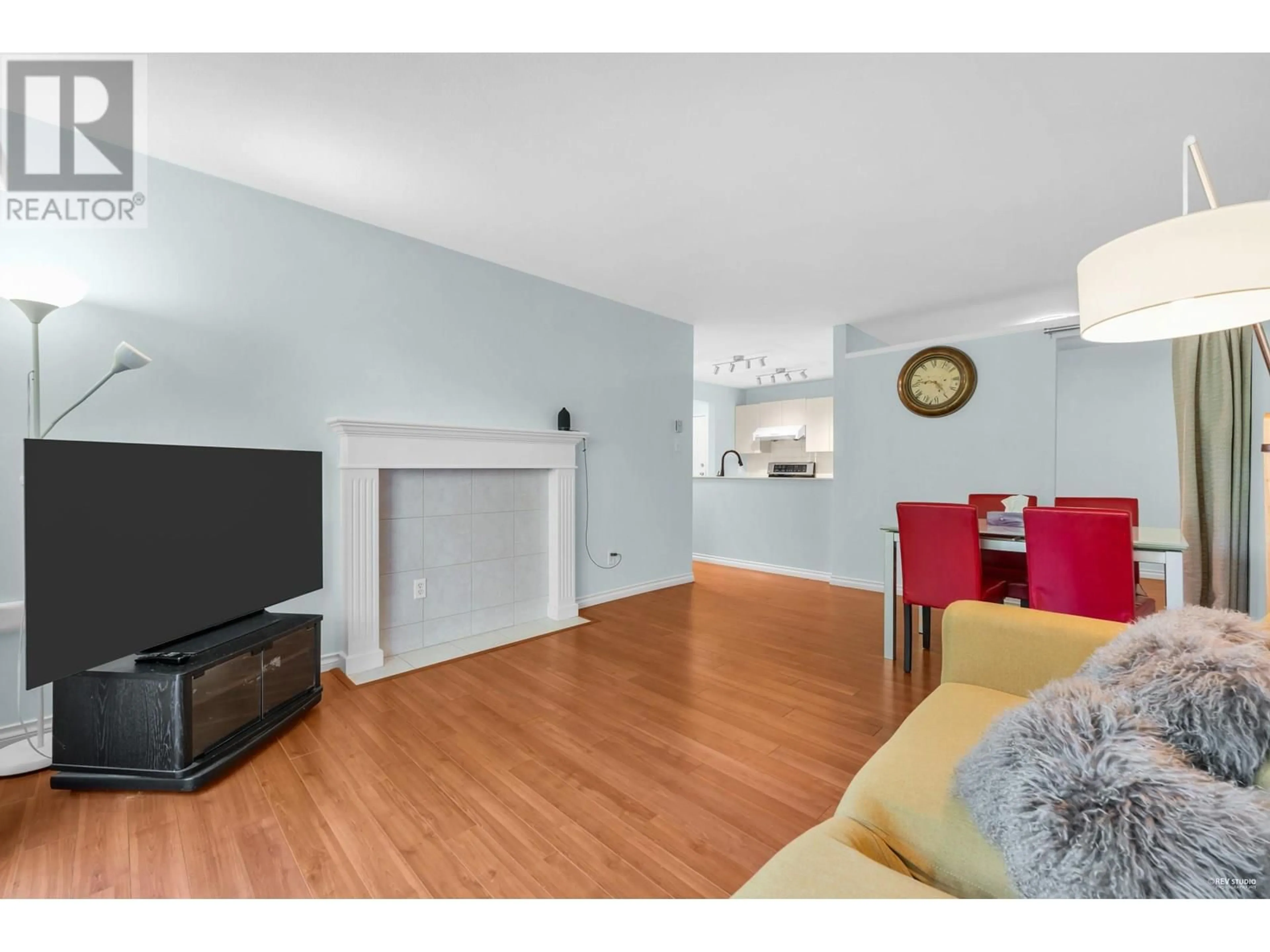Living room with furniture, wood/laminate floor for 217 - 7480 ST. ALBANS ROAD, Richmond British Columbia V6Y2K6
