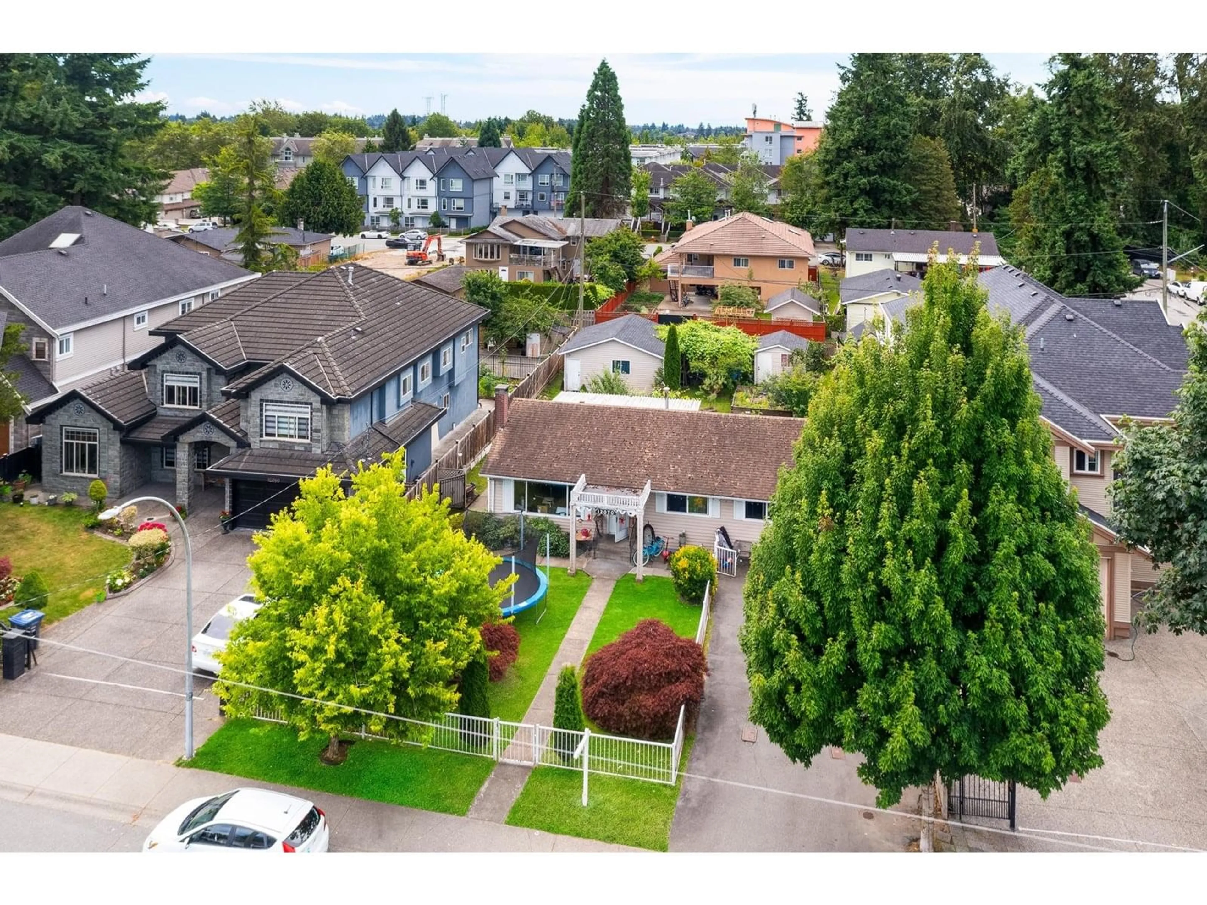 A pic from outside/outdoor area/front of a property/back of a property/a pic from drone, street for 12070 76A, Surrey British Columbia V3W2W5
