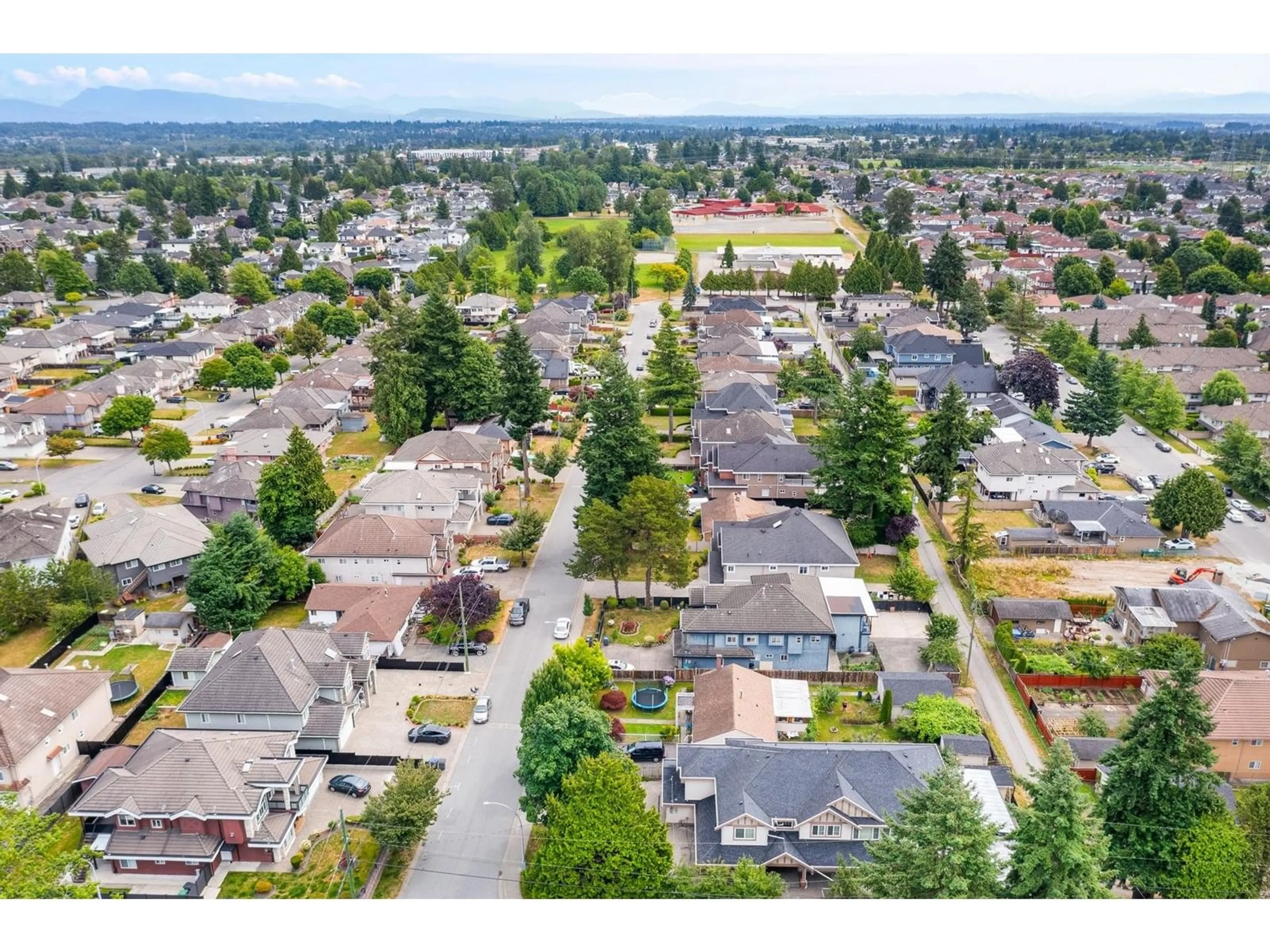 A pic from outside/outdoor area/front of a property/back of a property/a pic from drone, street for 12070 76A, Surrey British Columbia V3W2W5