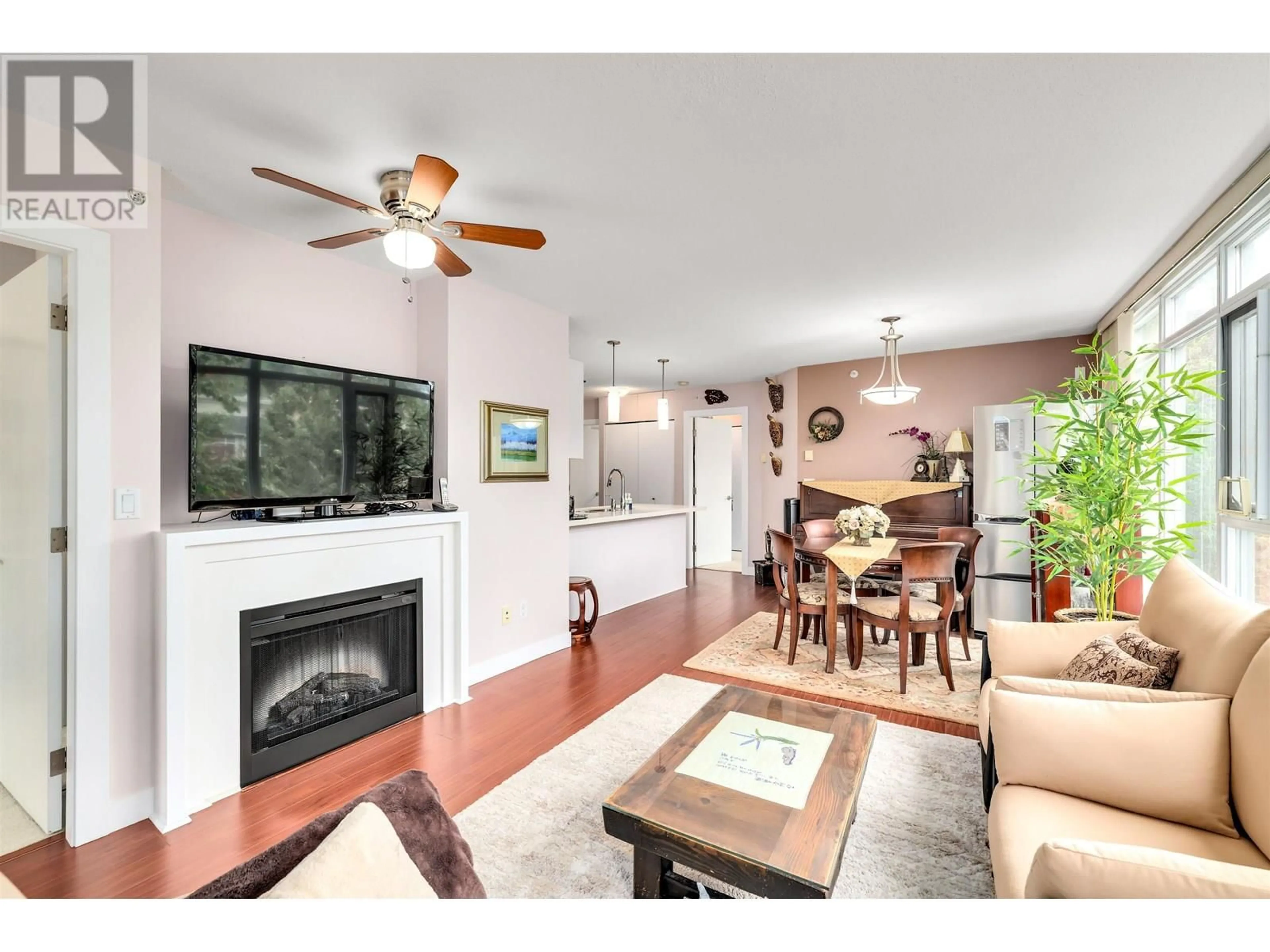 Living room with furniture, wood/laminate floor for 303 - 7090 EDMONDS STREET, Burnaby British Columbia V3N0C6