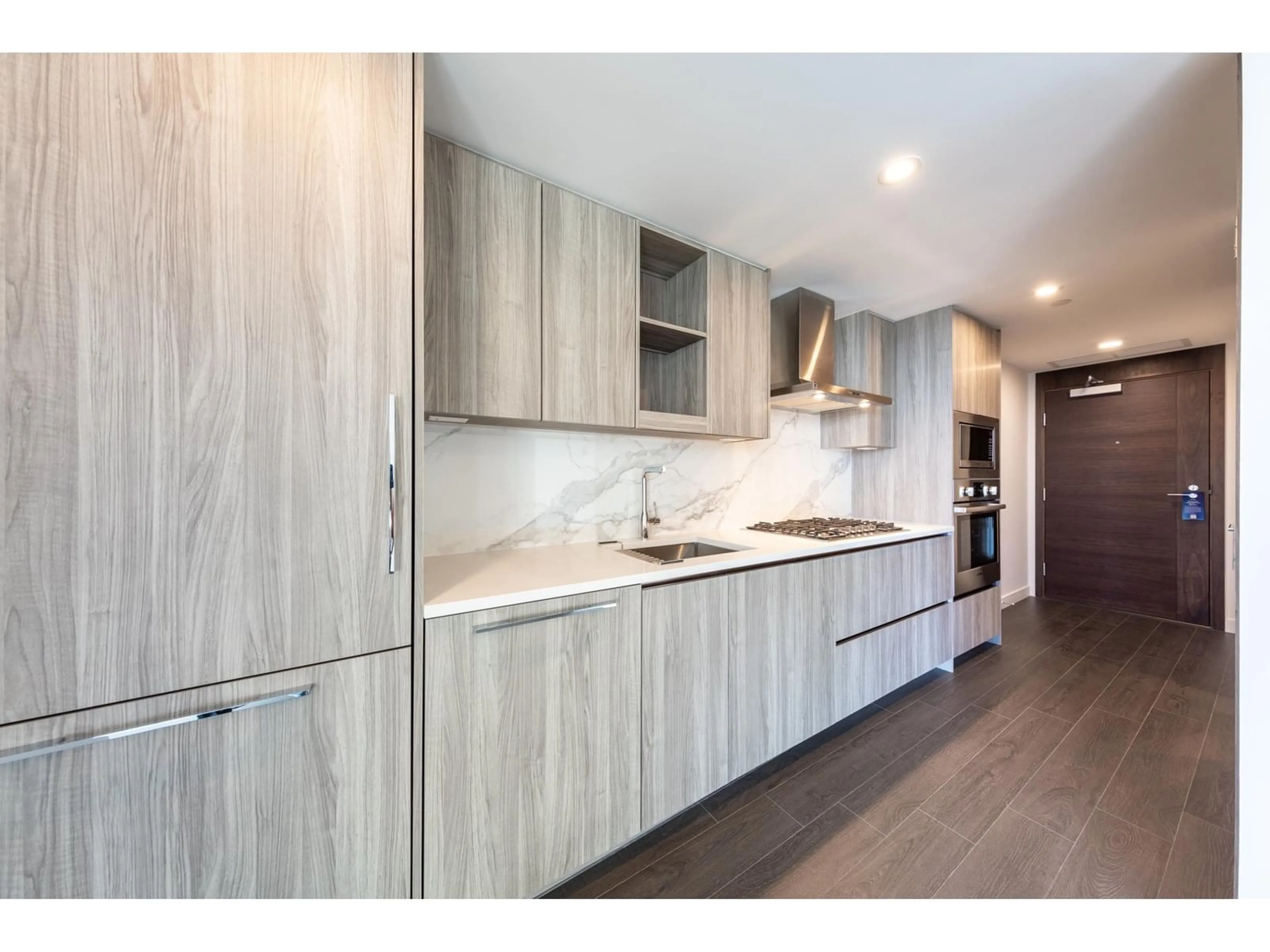 Open concept kitchen, wood/laminate floor for 2402 - 13768 100, Surrey British Columbia V3T0V2