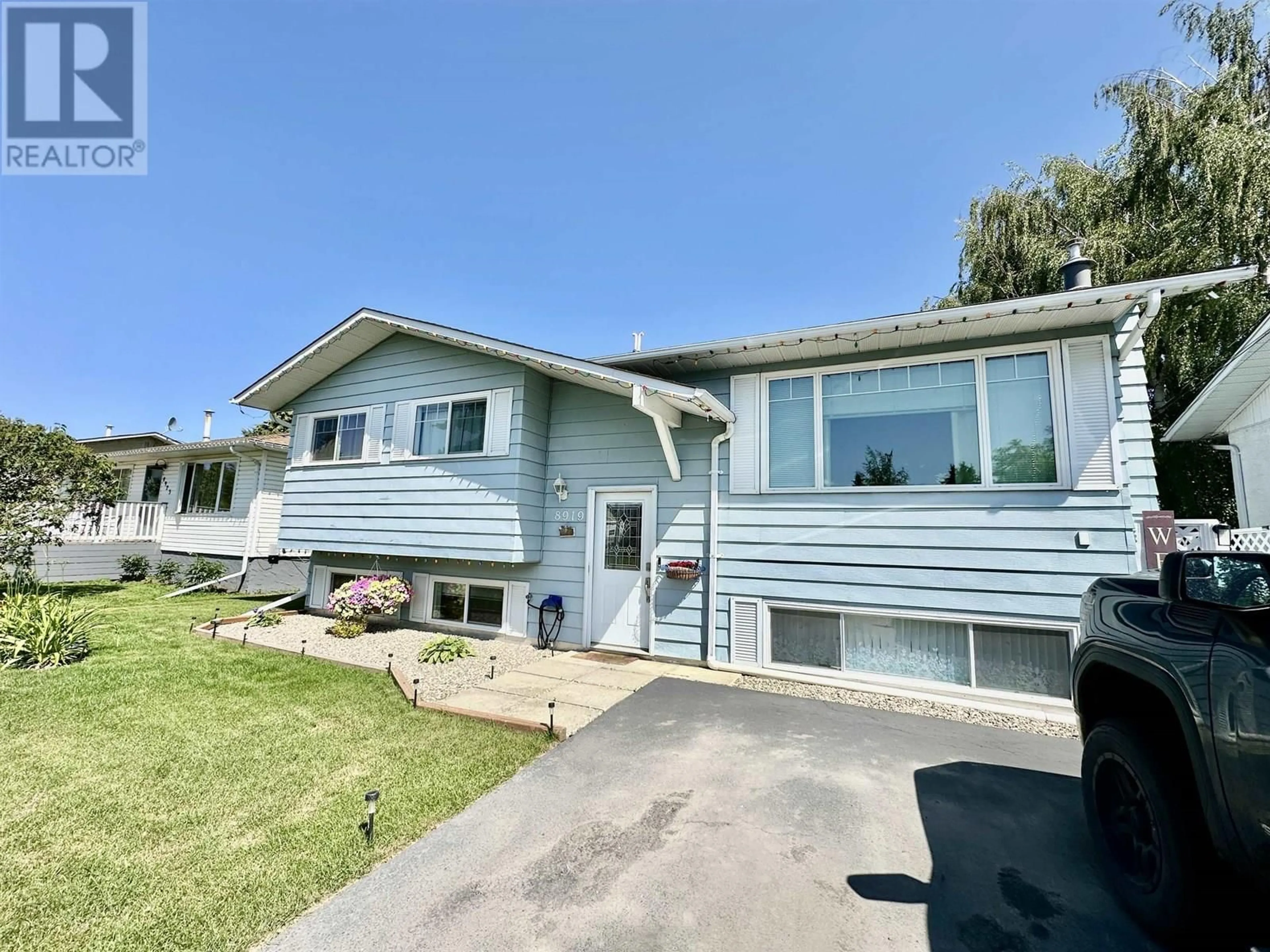 Home with vinyl exterior material, street for 8919 90 STREET, Fort St. John British Columbia V1J4Z1