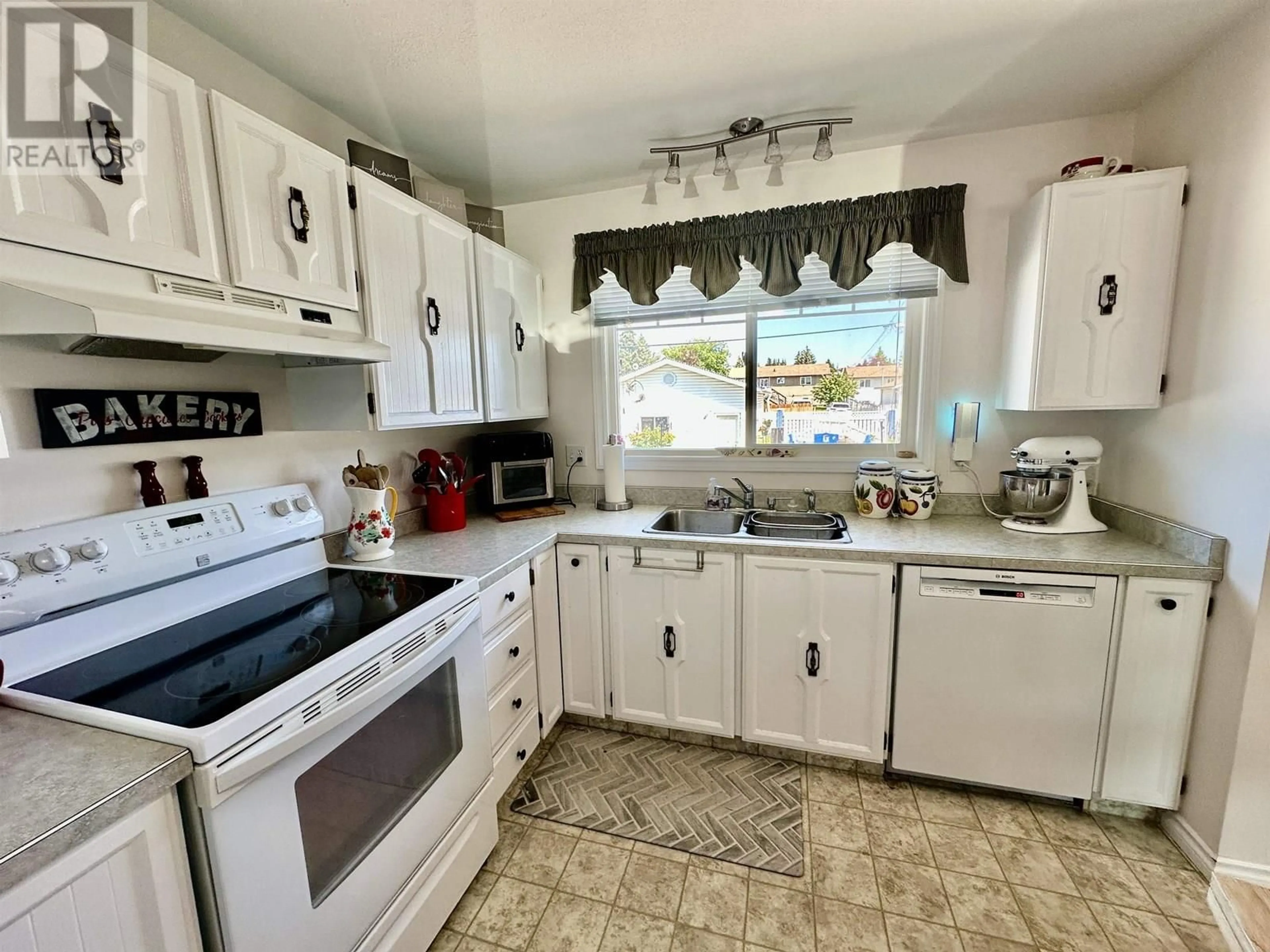 Standard kitchen, ceramic/tile floor for 8919 90 STREET, Fort St. John British Columbia V1J4Z1