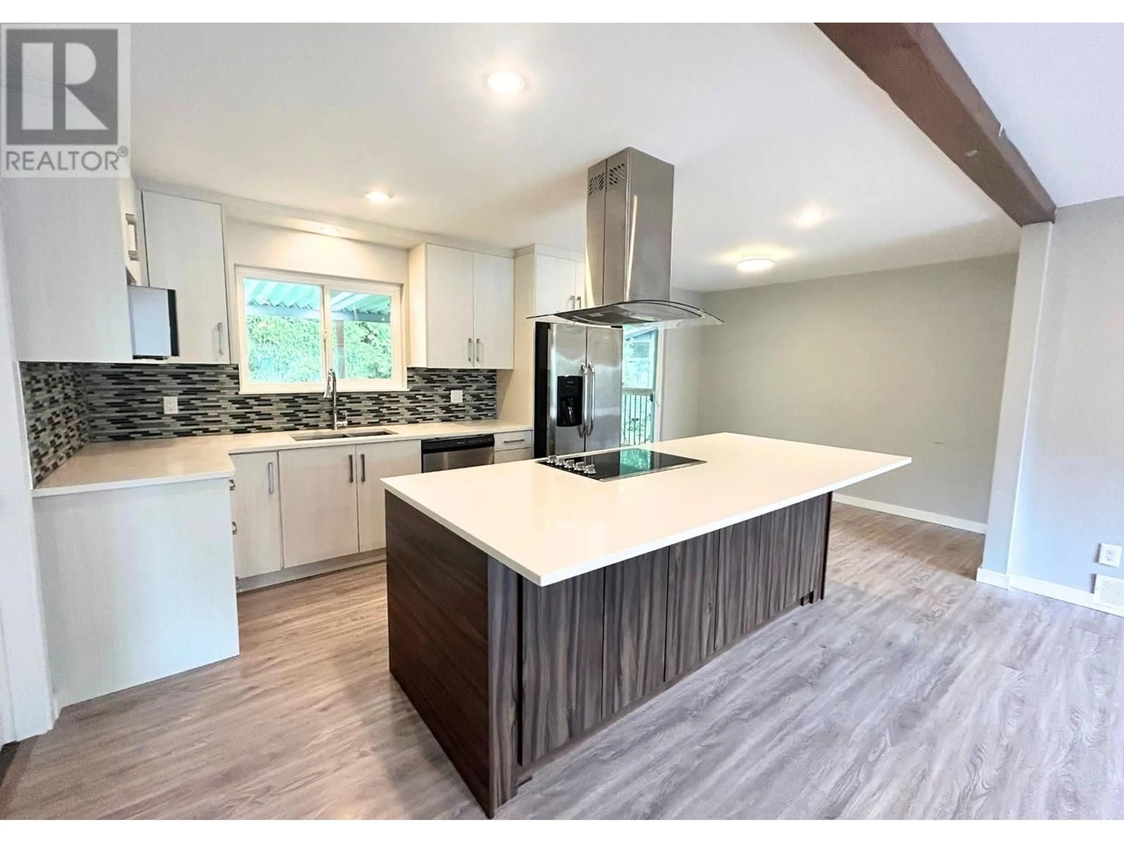 Open concept kitchen, wood/laminate floor for 22489 BRICKWOOD CLOSE, Maple Ridge British Columbia V2X2E6