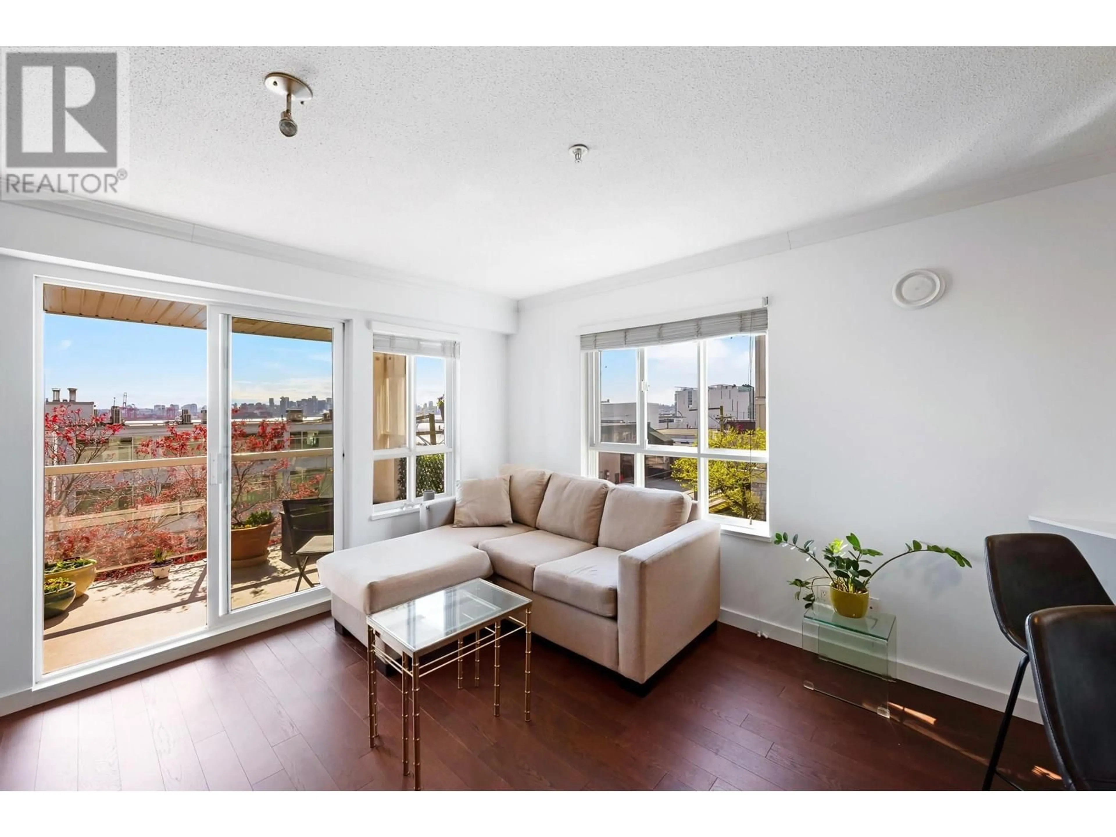 Living room with furniture, wood/laminate floor for 213 - 365 1ST STREET, North Vancouver British Columbia V7L4W5