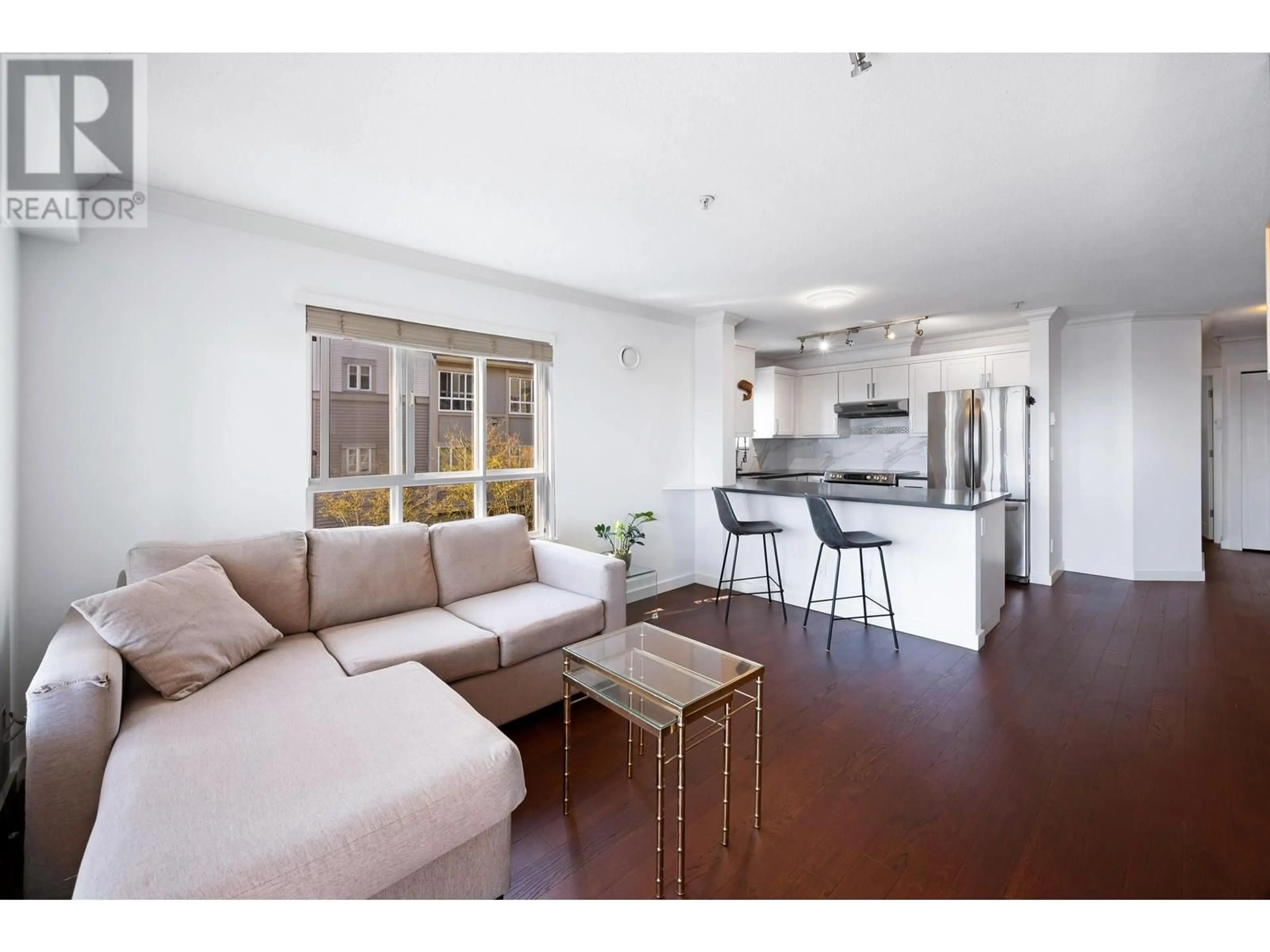 Living room with furniture, wood/laminate floor for 213 - 365 1ST STREET, North Vancouver British Columbia V7L4W5