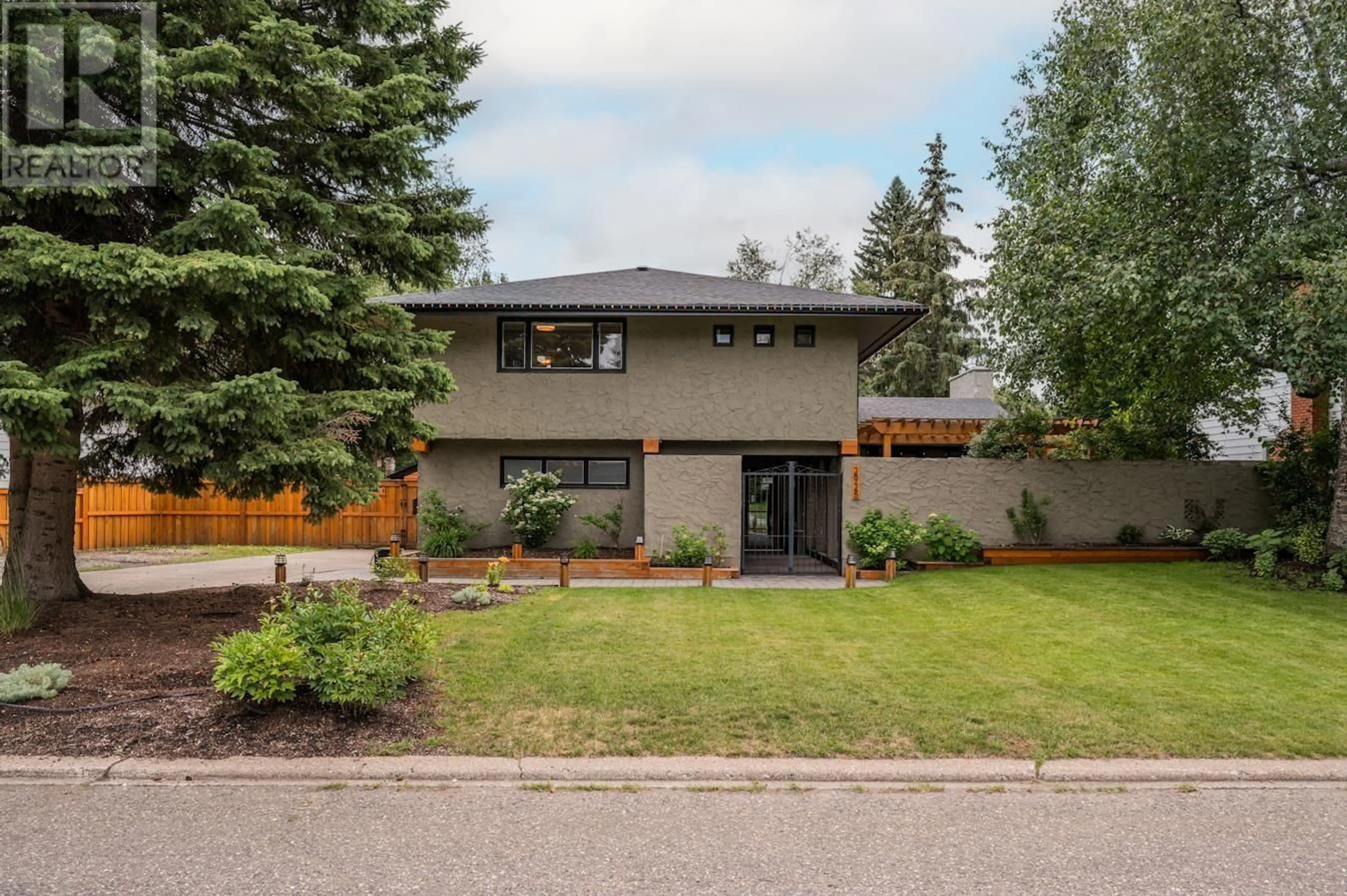 Home with brick exterior material, street for 2925 NOTRE DAME DRIVE, Prince George British Columbia V2N2B1
