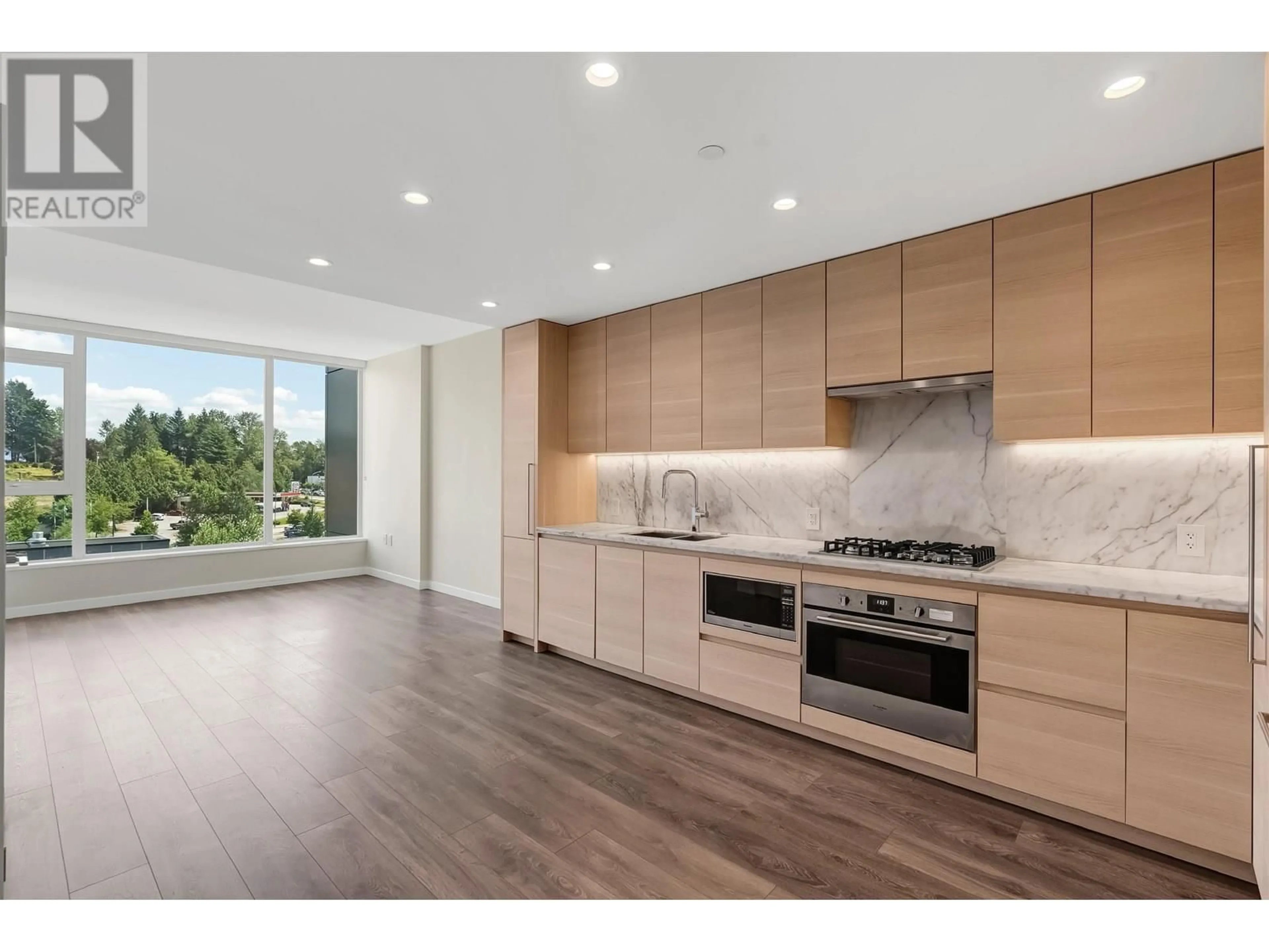Open concept kitchen, wood/laminate floor for 903 - 305 MORRISSEY ROAD, Port Moody British Columbia V3H0M3