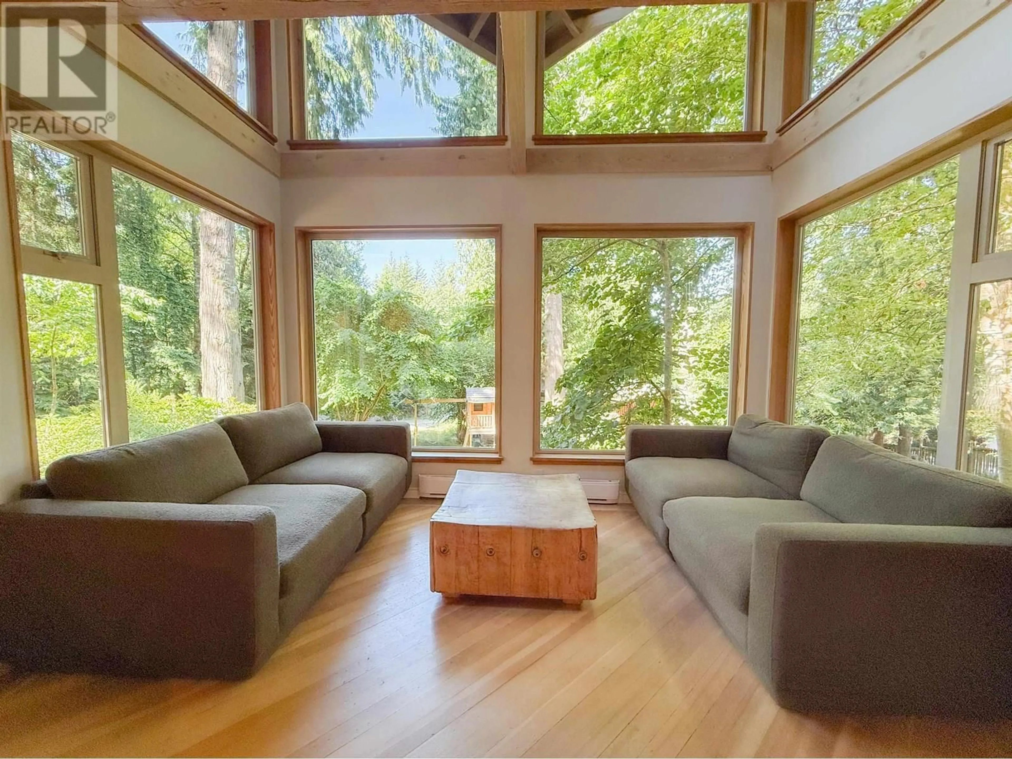 Living room with furniture, wood/laminate floor for 901 WINDJAMMER ROAD, Bowen Island British Columbia V0N1G2