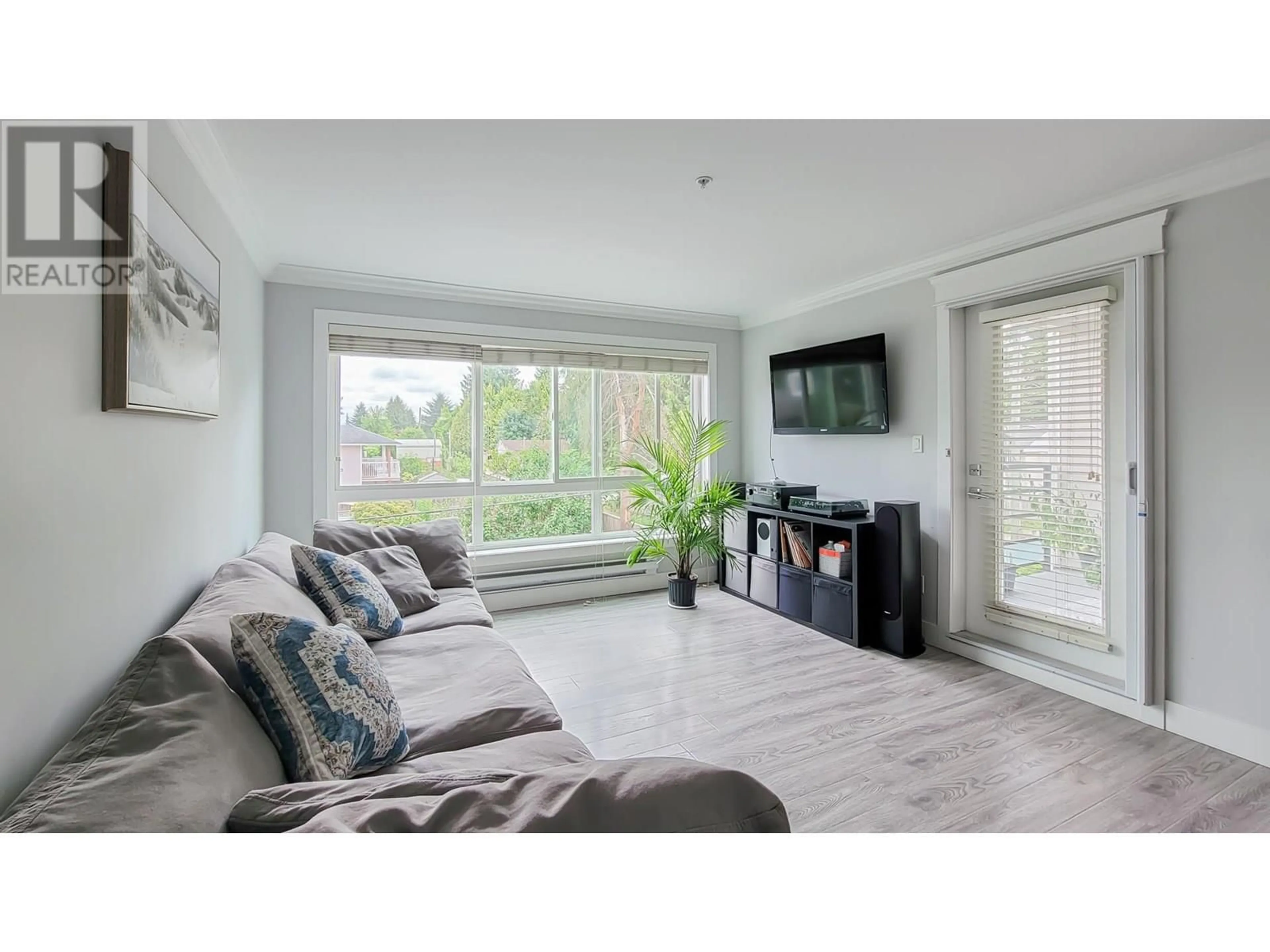 Living room with furniture, wood/laminate floor for 308 - 2268 SHAUGHNESSY STREET, Port Coquitlam British Columbia V3C3C8