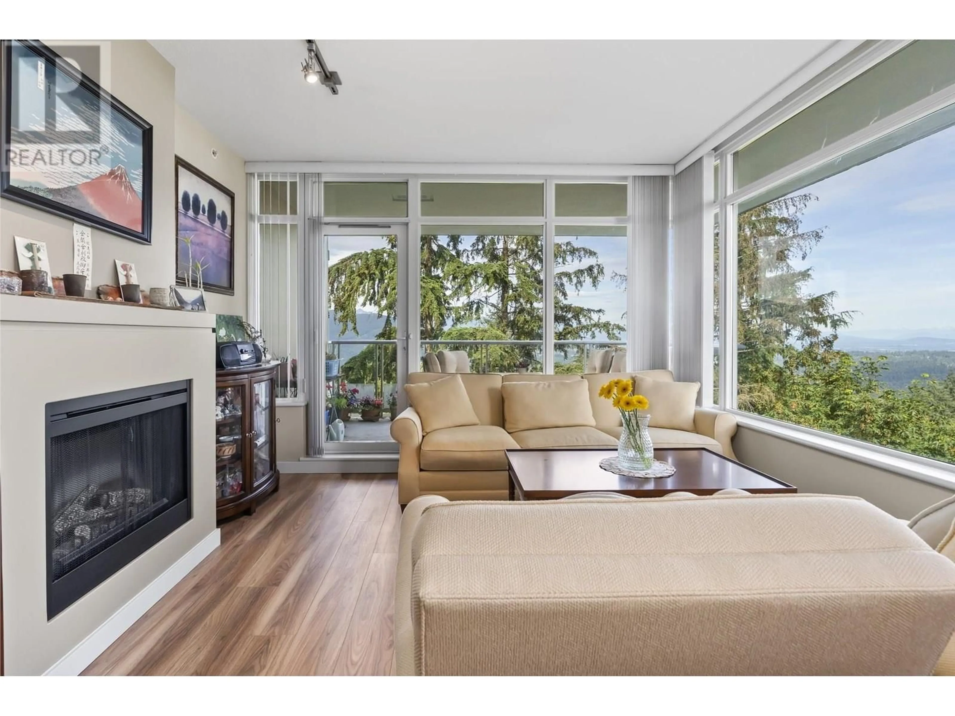 Living room with furniture, wood/laminate floor for 710 - 9266 UNIVERSITY CRESCENT, Burnaby British Columbia V5A4Z1