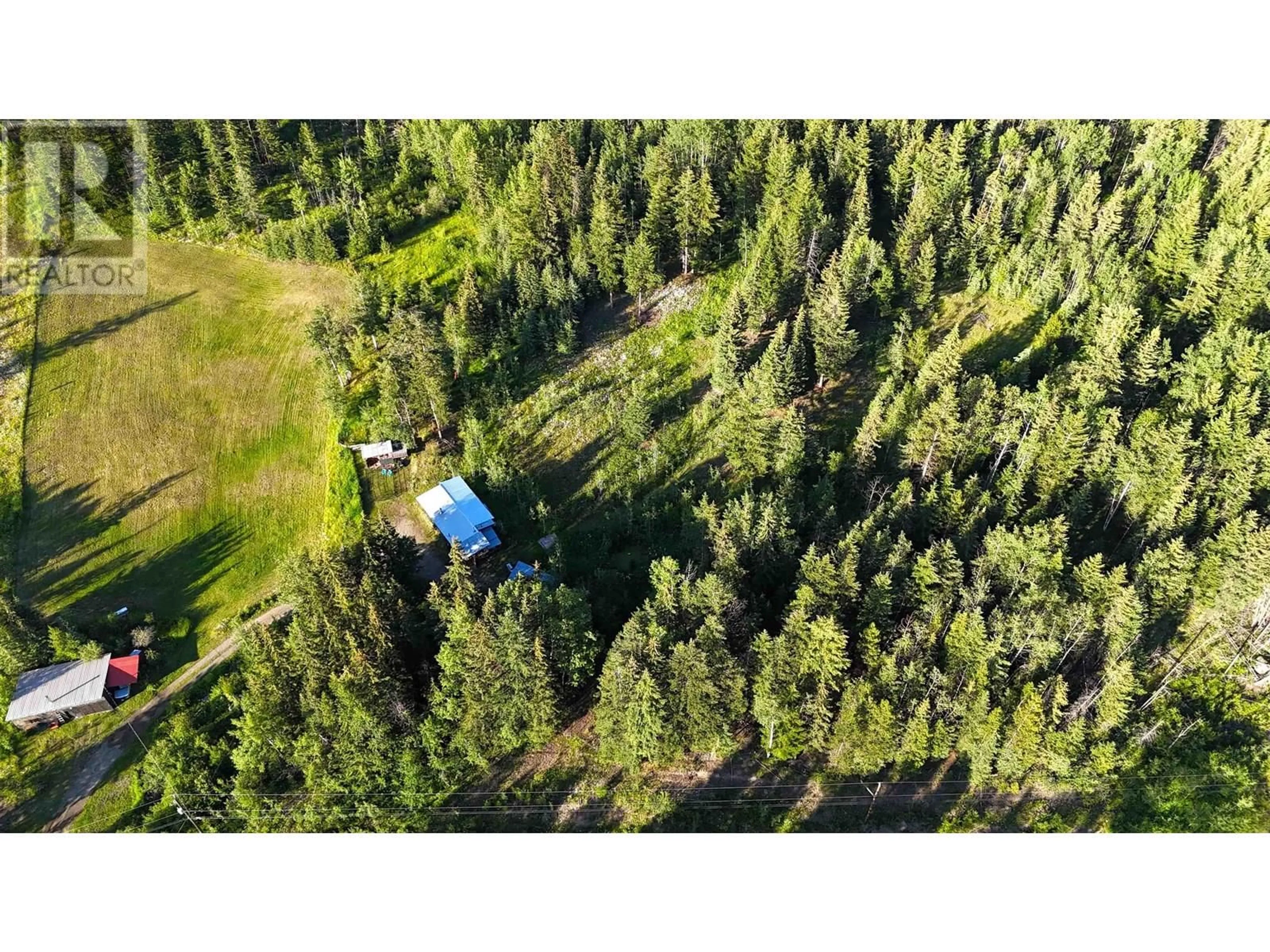 A pic from outside/outdoor area/front of a property/back of a property/a pic from drone, forest/trees view for 3729 SPOKIN LAKE ROAD, 150 Mile House British Columbia V0K2G0