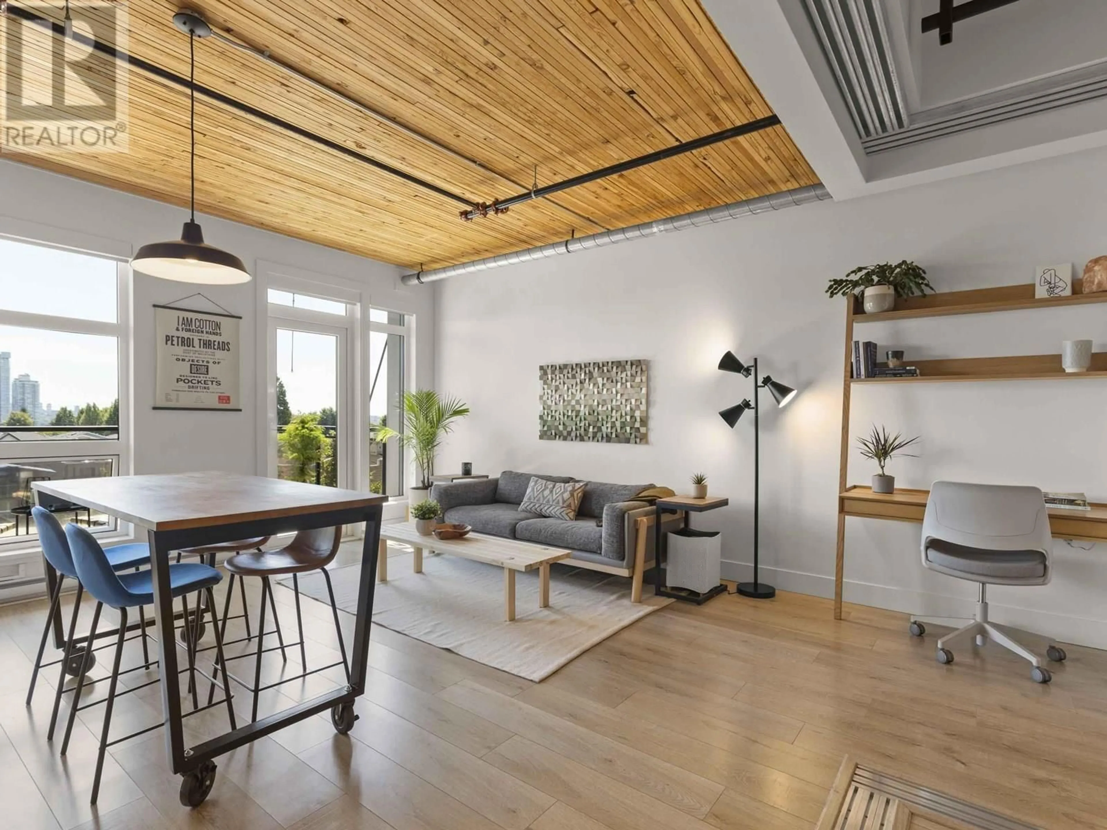 Living room with furniture, wood/laminate floor for 308 - 4223 HASTINGS STREET, Burnaby British Columbia V5C2J5