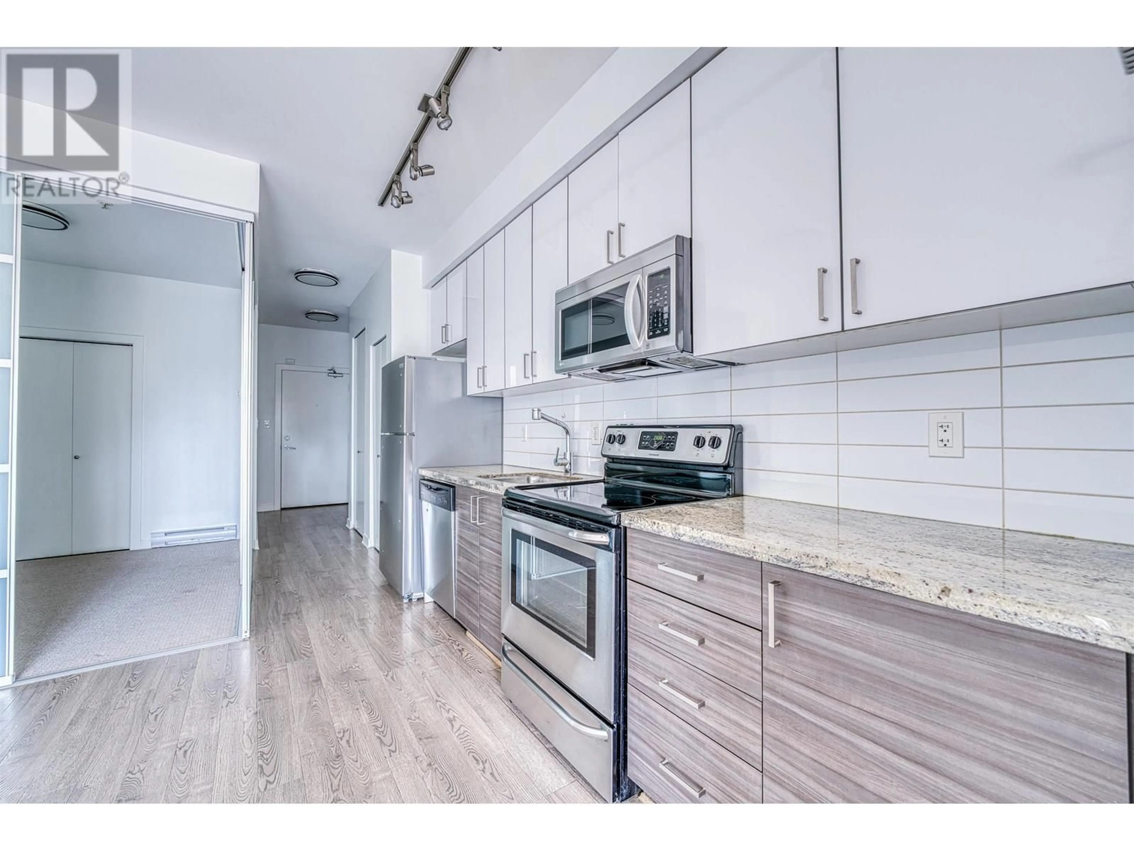 Standard kitchen, wood/laminate floor for 308 - 3688 INVERNESS STREET, Vancouver British Columbia V5V0C5