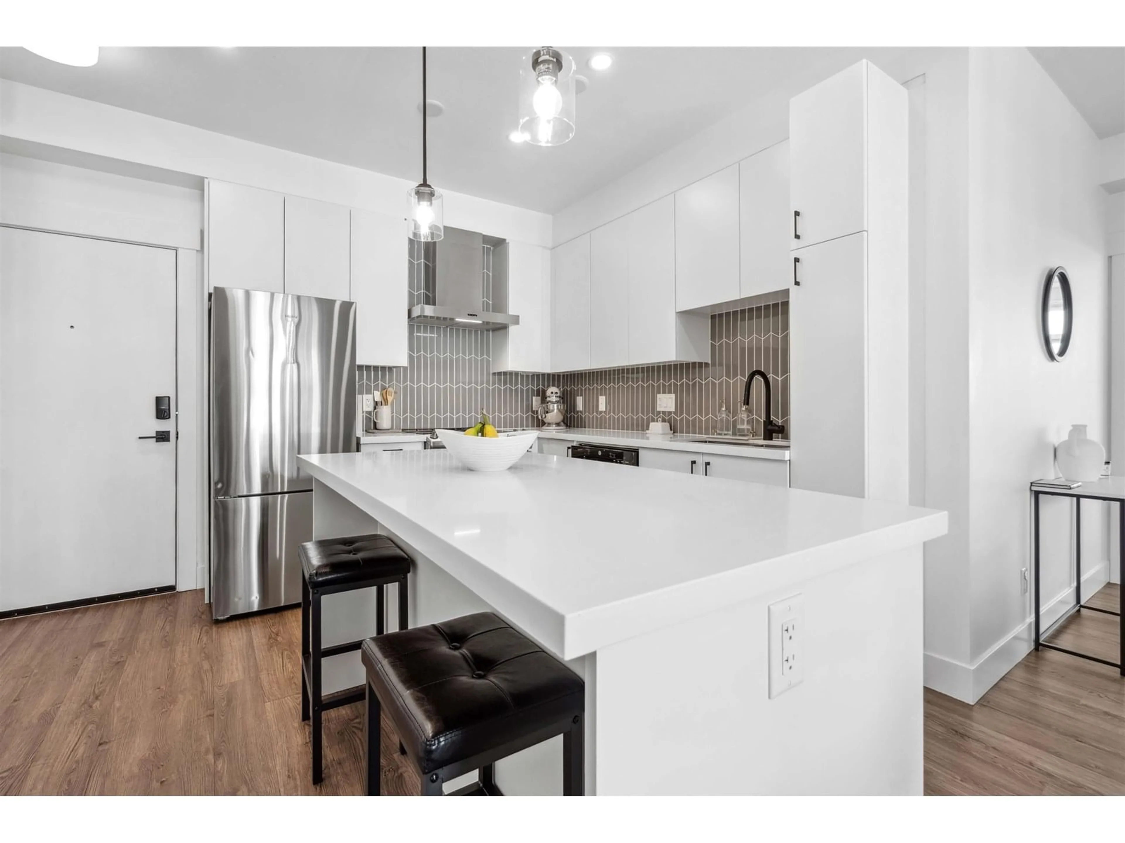 Open concept kitchen, wood/laminate floor for A512 - 20838 78B, Langley British Columbia V2Y3M1