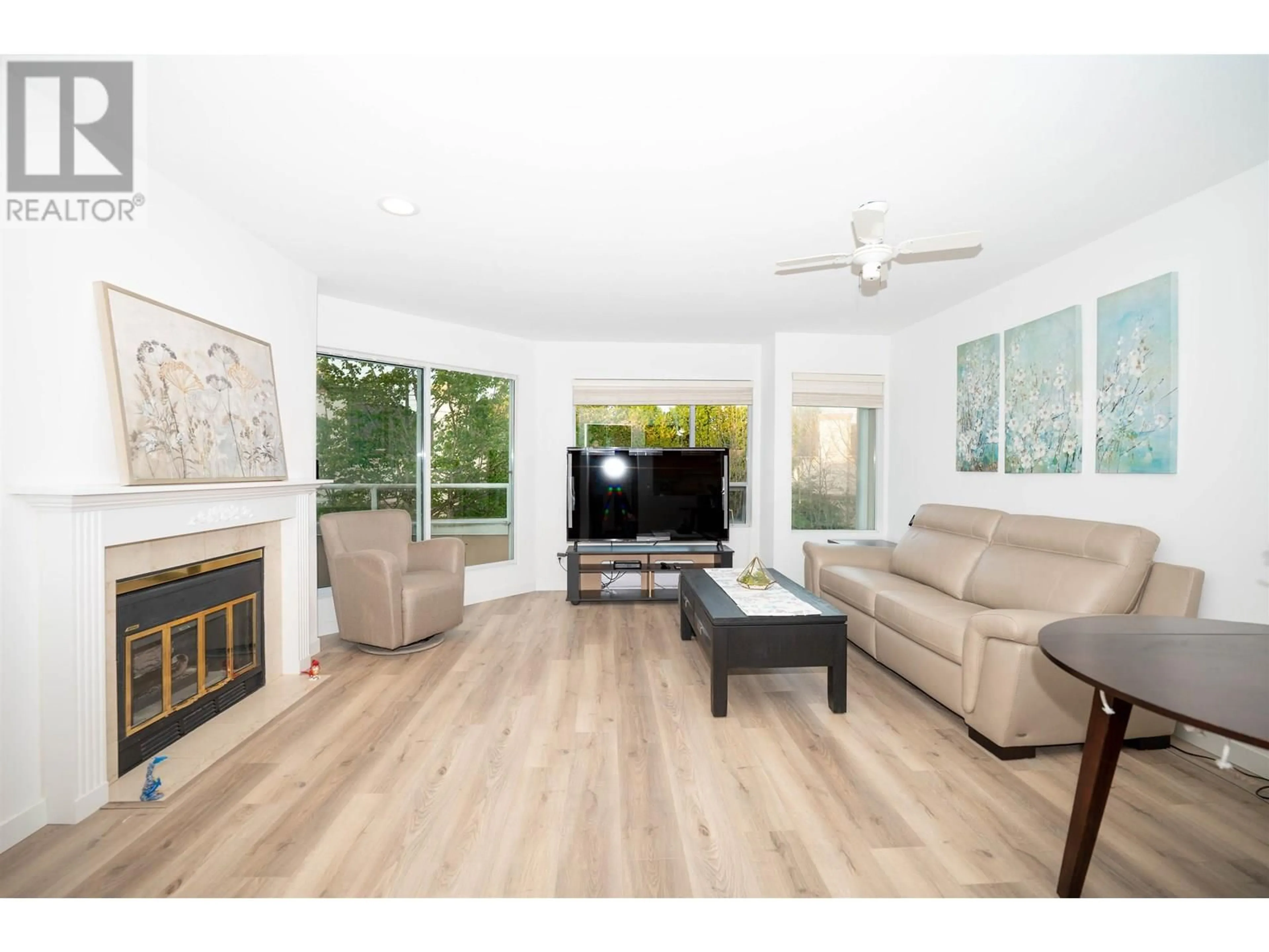 Living room with furniture, wood/laminate floor for 301 - 7480 GILBERT ROAD, Richmond British Columbia V7C3W2