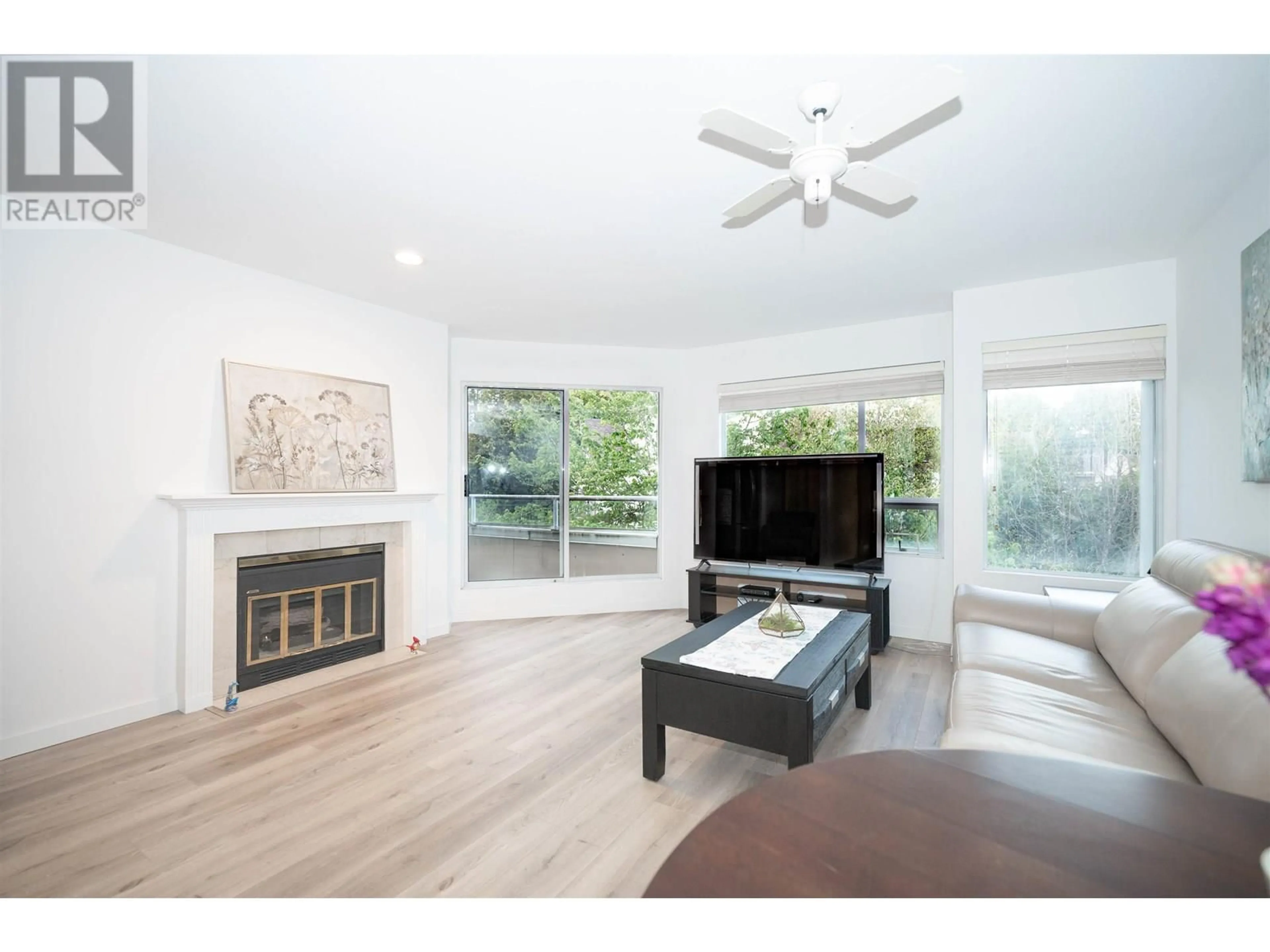 Living room with furniture, wood/laminate floor for 301 - 7480 GILBERT ROAD, Richmond British Columbia V7C3W2