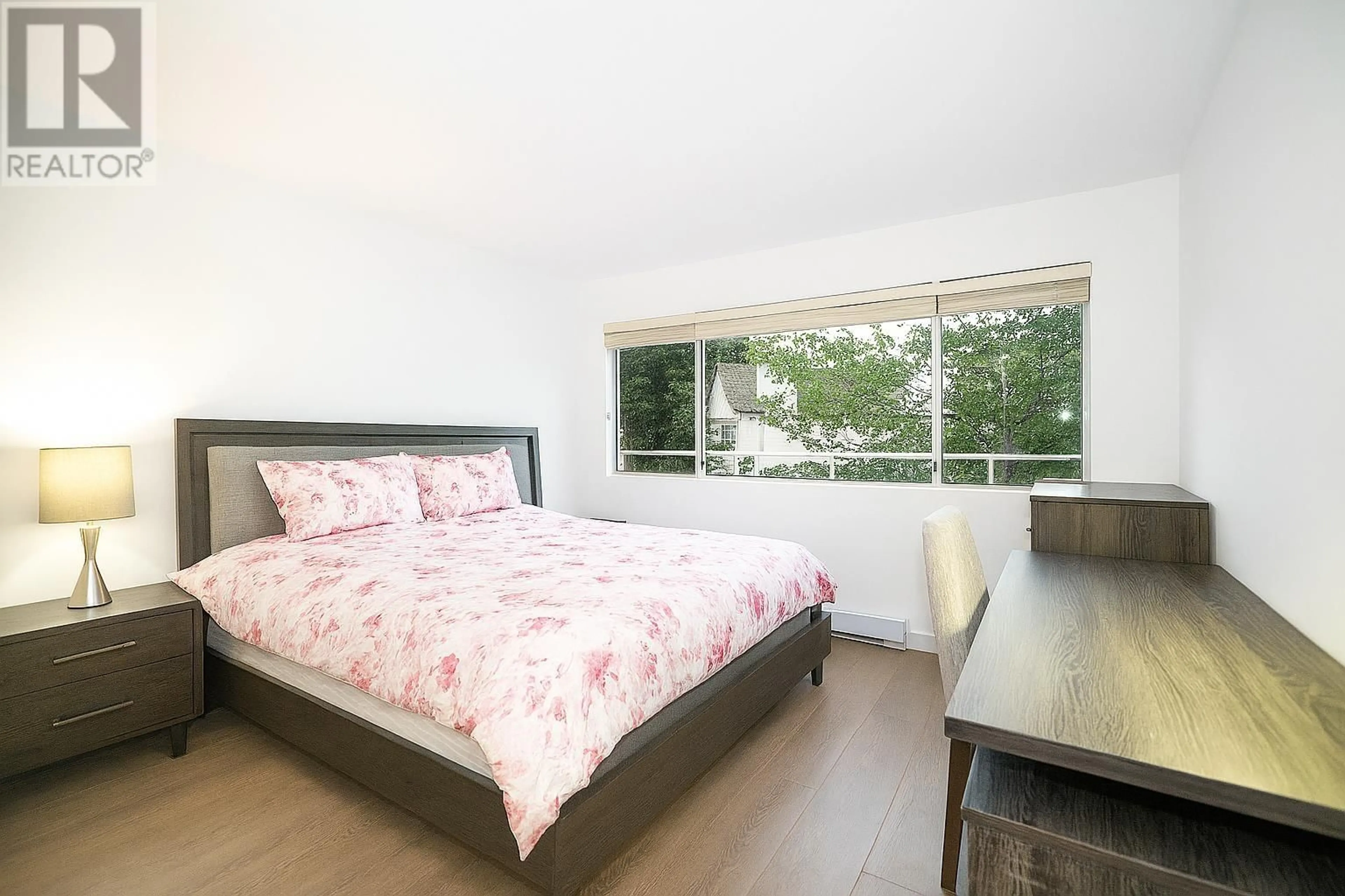 Bedroom with bed, wood/laminate floor for 301 - 7480 GILBERT ROAD, Richmond British Columbia V7C3W2