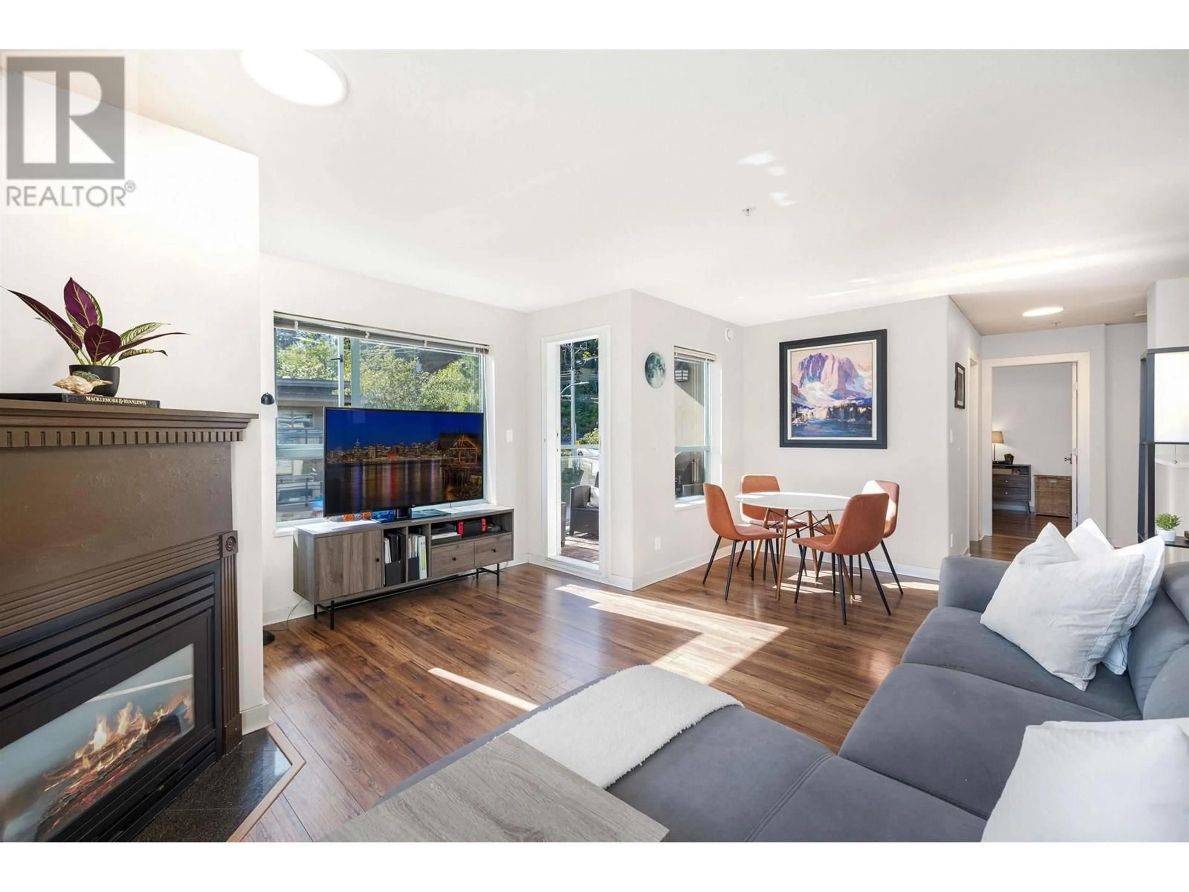 Living room with furniture, wood/laminate floor for 302 - 1085 17TH STREET, North Vancouver British Columbia V7P3R3