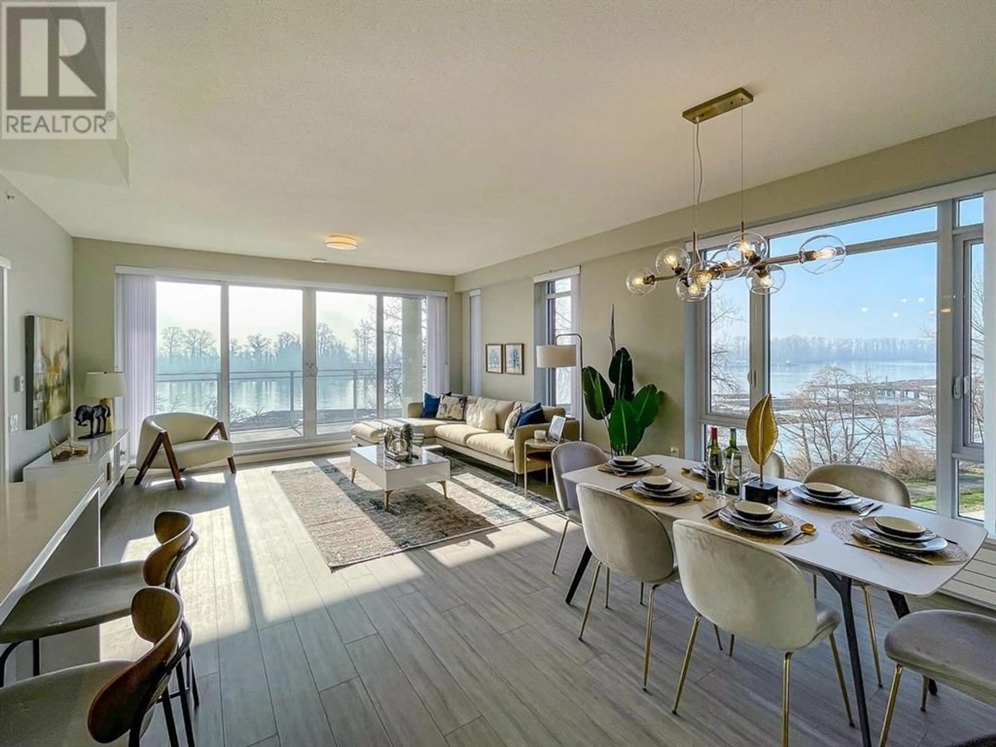 Living room with furniture, wood/laminate floor for 504 - 3188 RIVERWALK AVENUE, Vancouver British Columbia V5S0E7