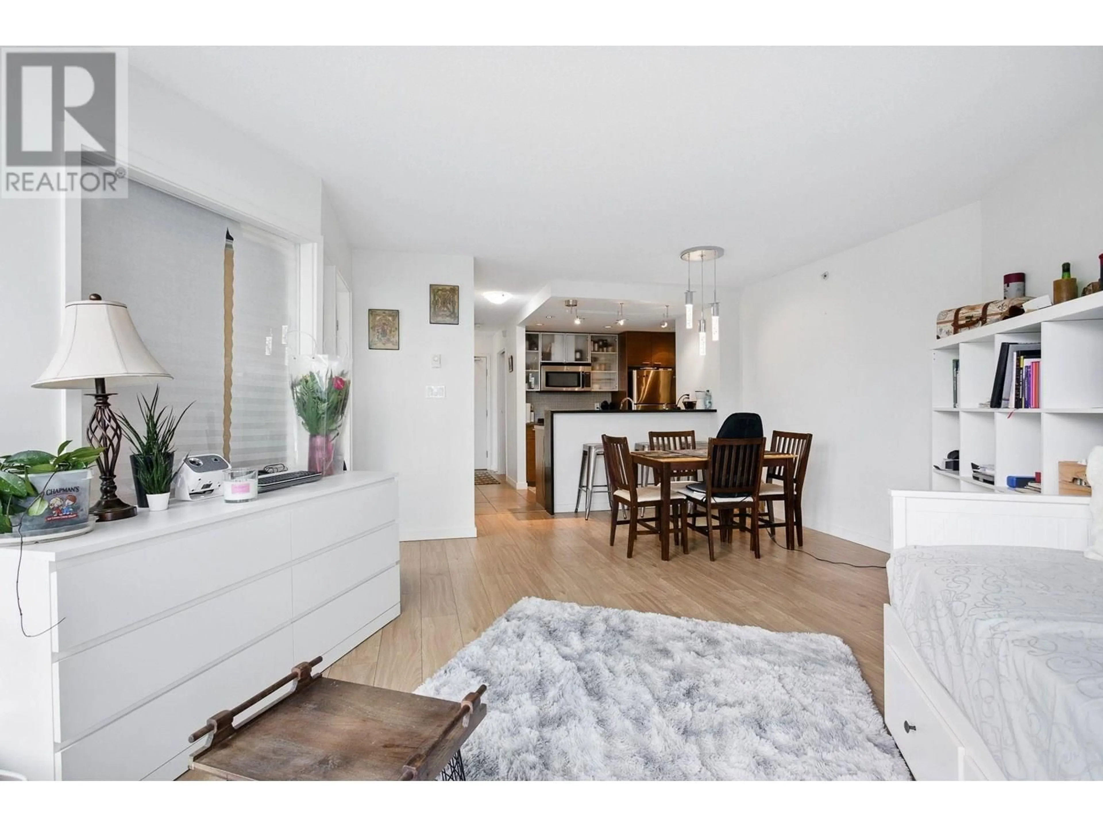 Open concept kitchen, wood/laminate floor for 803 - 980 COOPERAGE WAY, Vancouver British Columbia V6B0C3