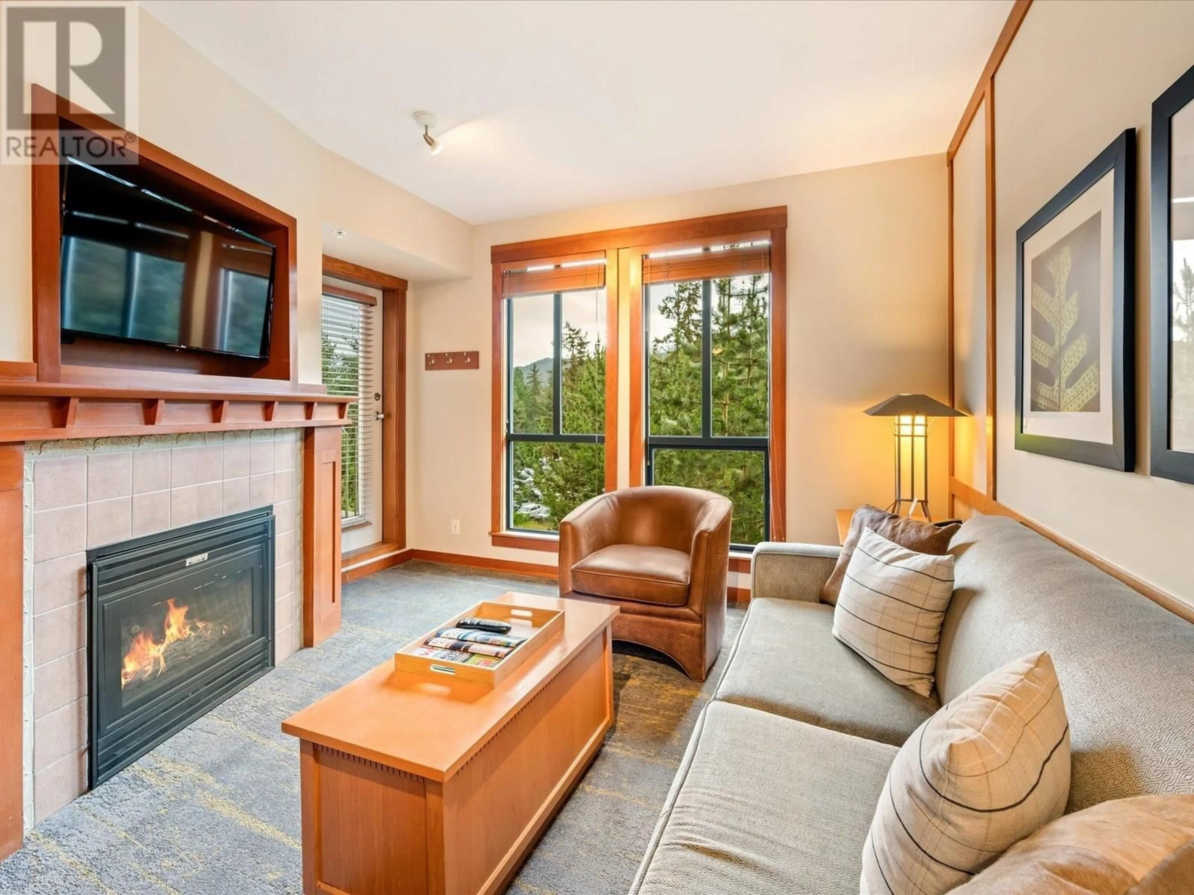 Living room with furniture, wood/laminate floor for 514 - 4320 SUNDIAL CRESCENT, Whistler British Columbia V8E1G6