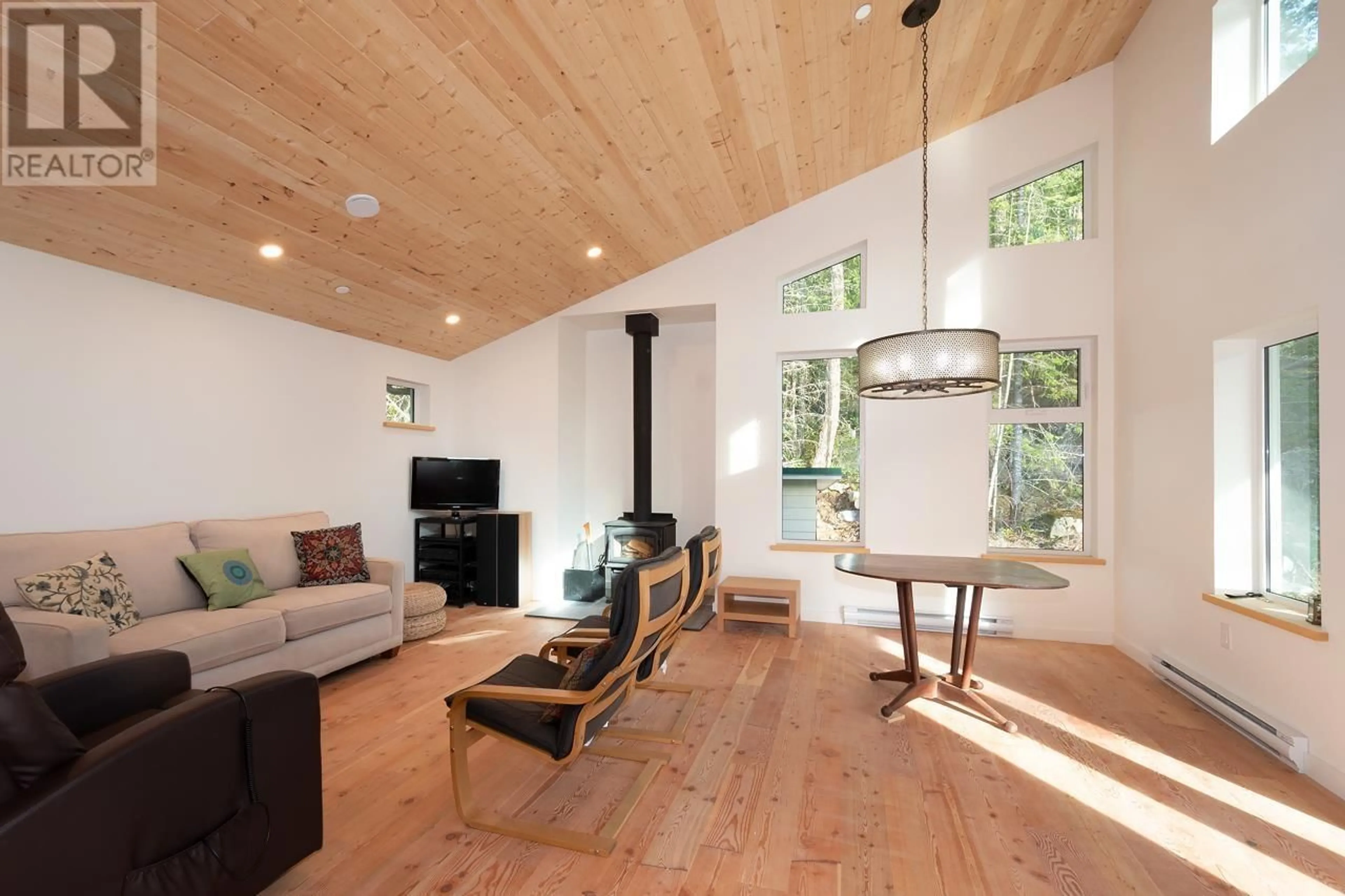 Living room with furniture, wood/laminate floor for 1580 EVERGREEN LANE, Bowen Island British Columbia V0N1G2
