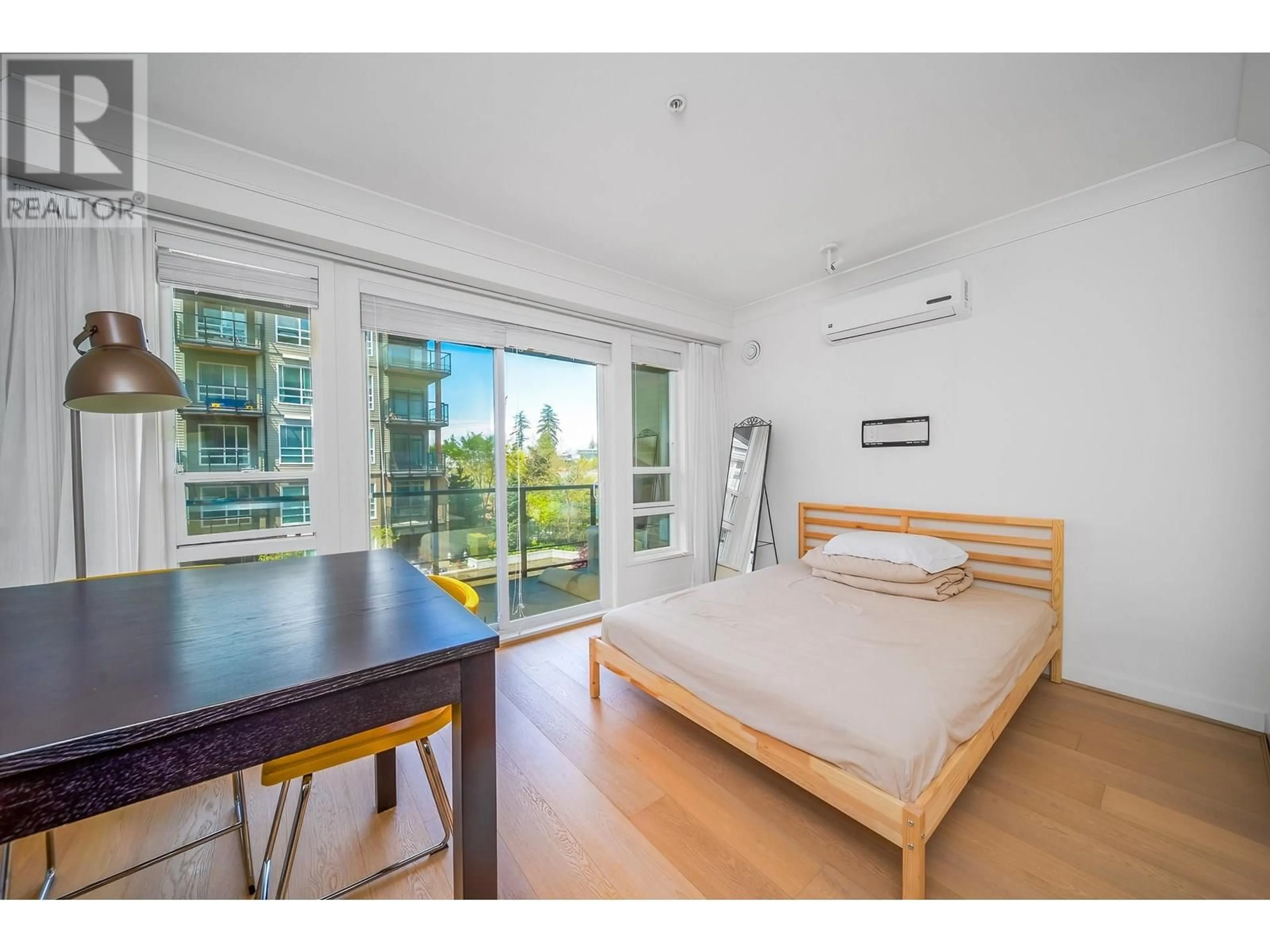 Bedroom with bed, wood/laminate floor for 311 - 6033 GRAY AVENUE, Vancouver British Columbia V6S0G3