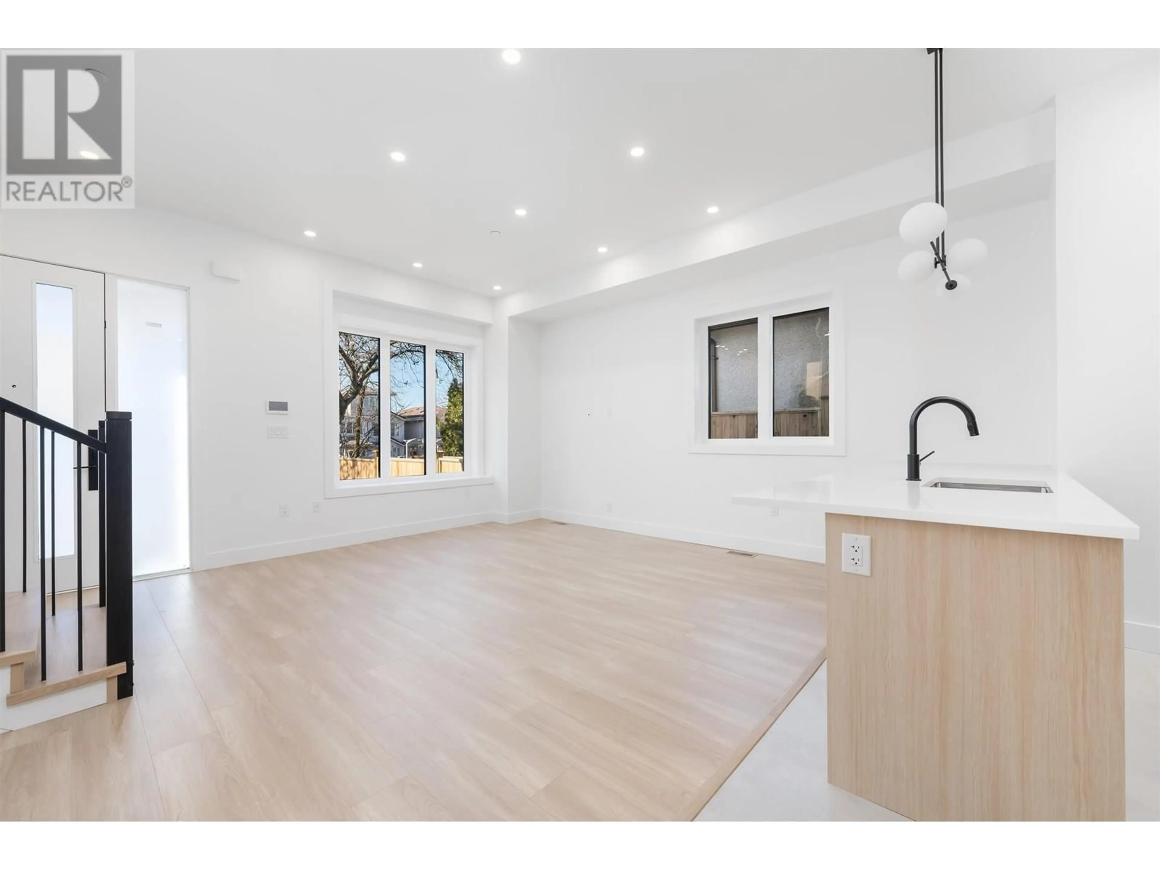 Open concept kitchen, wood/laminate floor for 4016 RUPERT STREET, Vancouver British Columbia V5R2H3