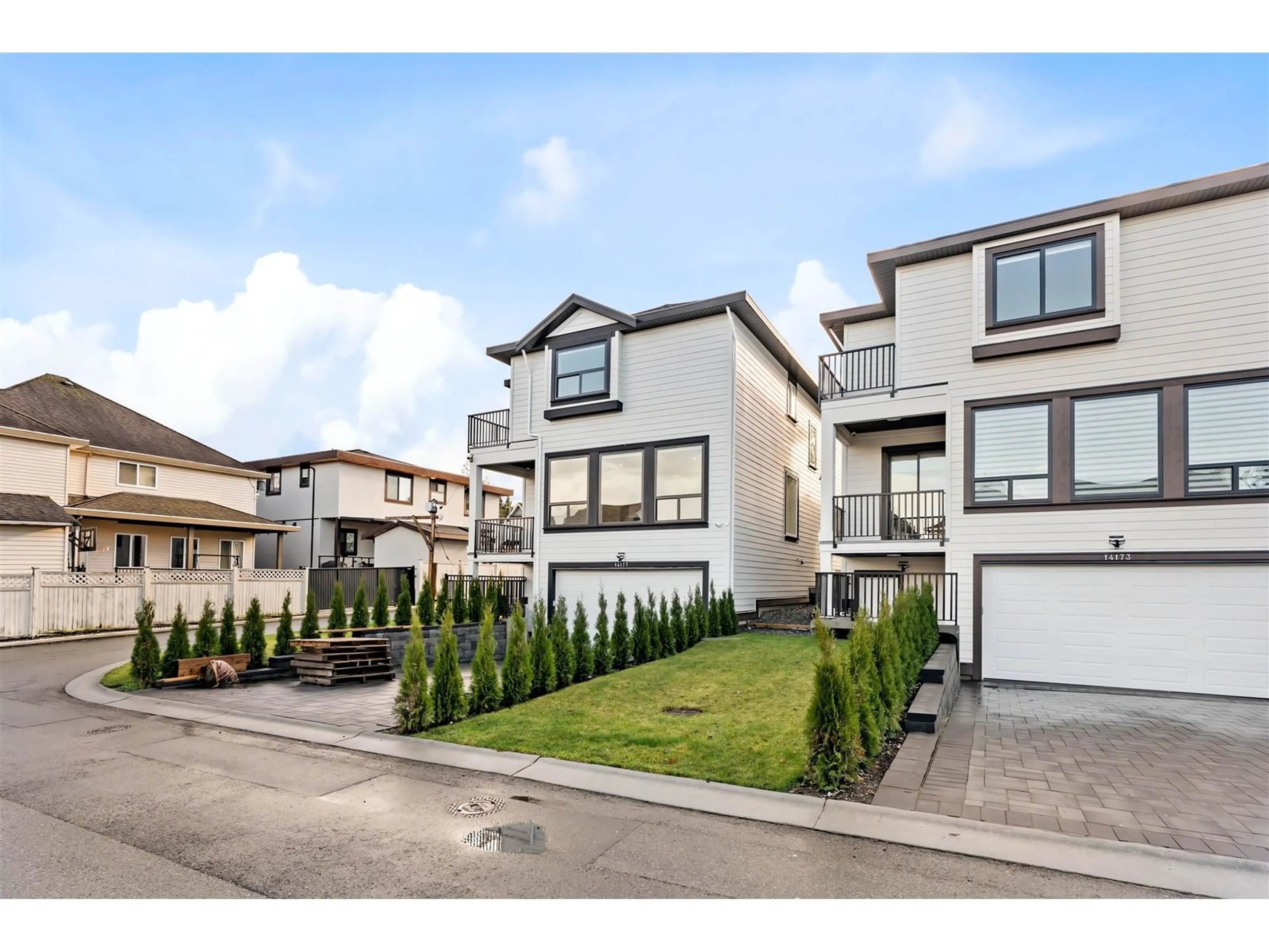 Home with vinyl exterior material, street for 14165 60A, Surrey British Columbia V3X1C3