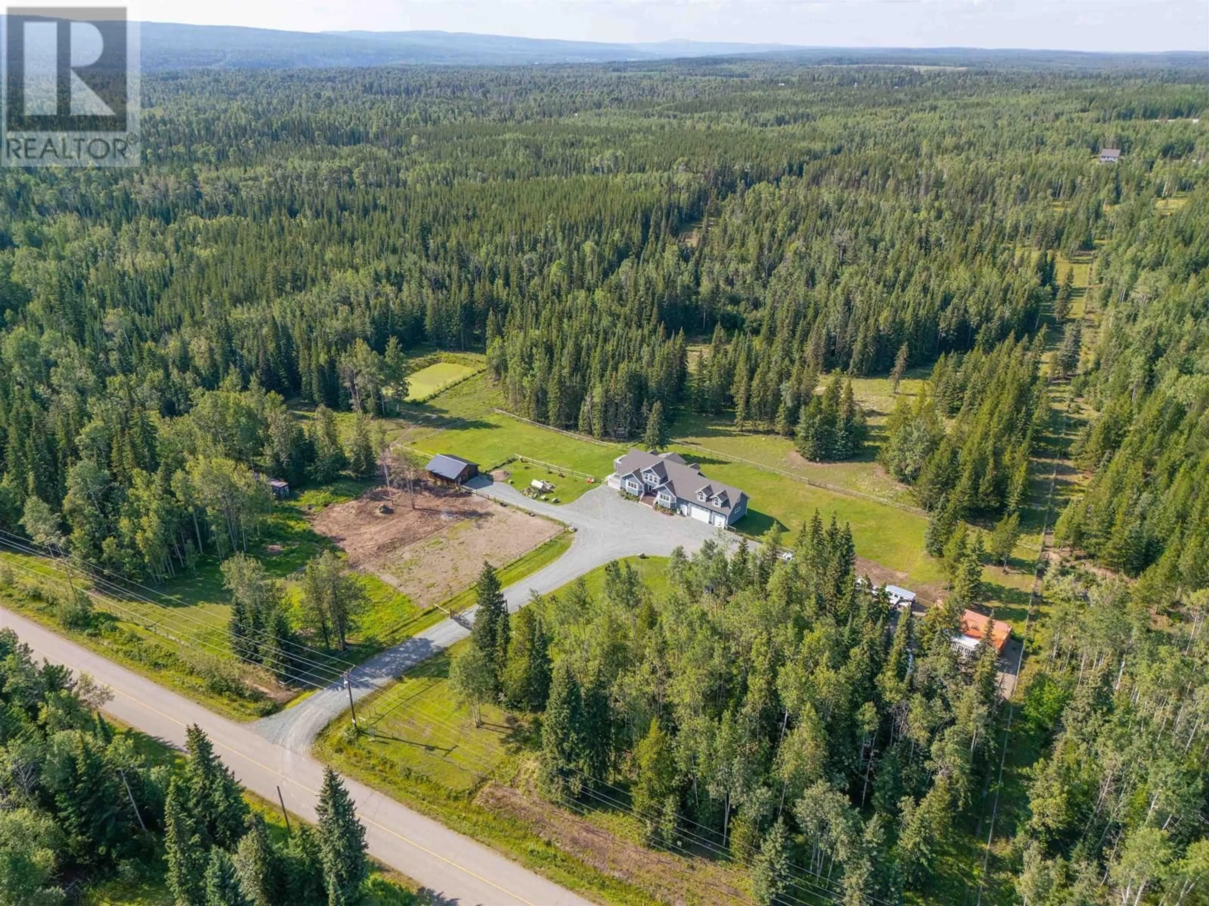A pic from outside/outdoor area/front of a property/back of a property/a pic from drone, forest/trees view for 3900 15 MILE ROAD, Prince George British Columbia V2N5Y4
