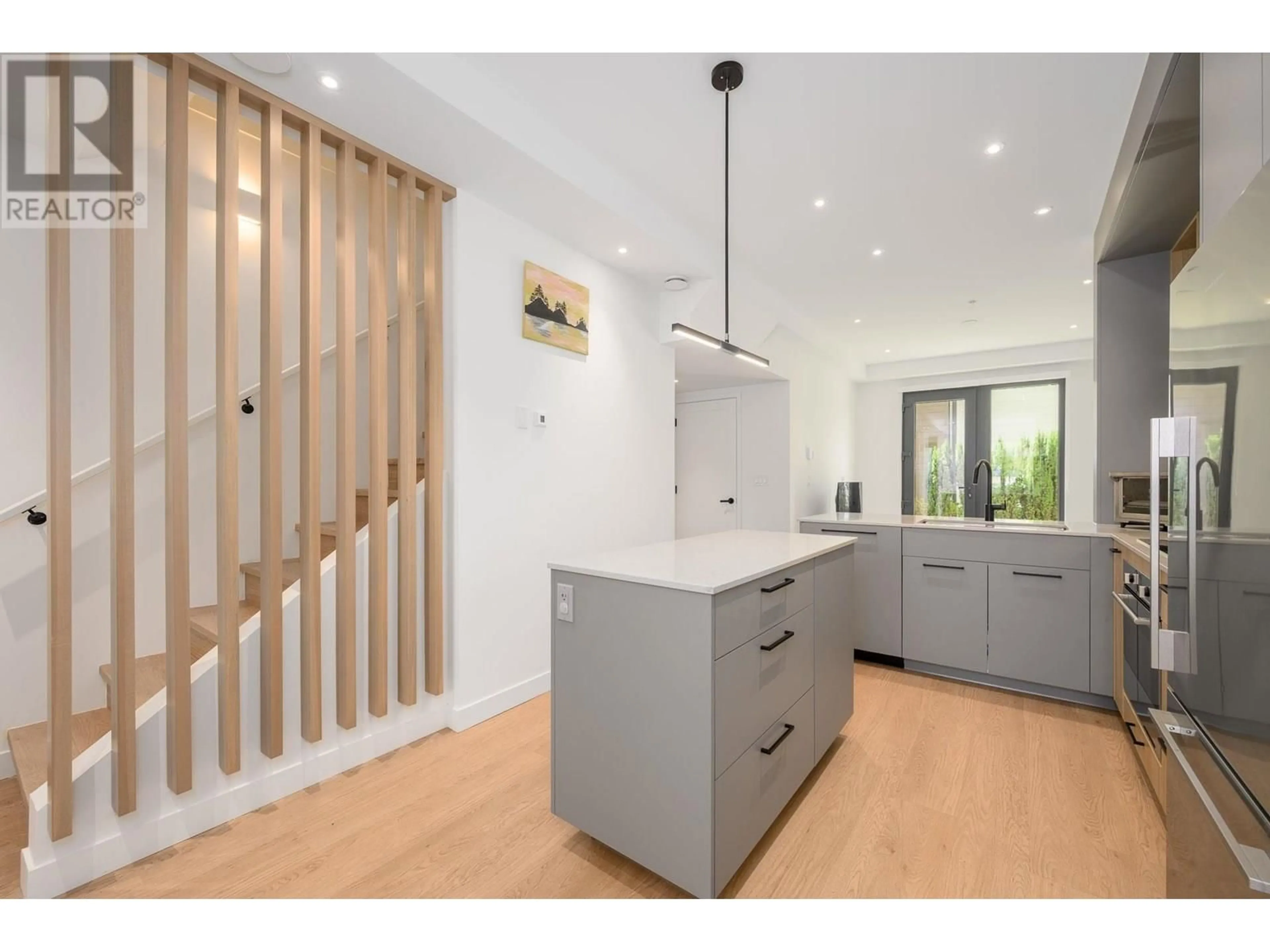 Open concept kitchen, wood/laminate floor for 203 - 606 FOSTER AVENUE, Coquitlam British Columbia V3J0L5