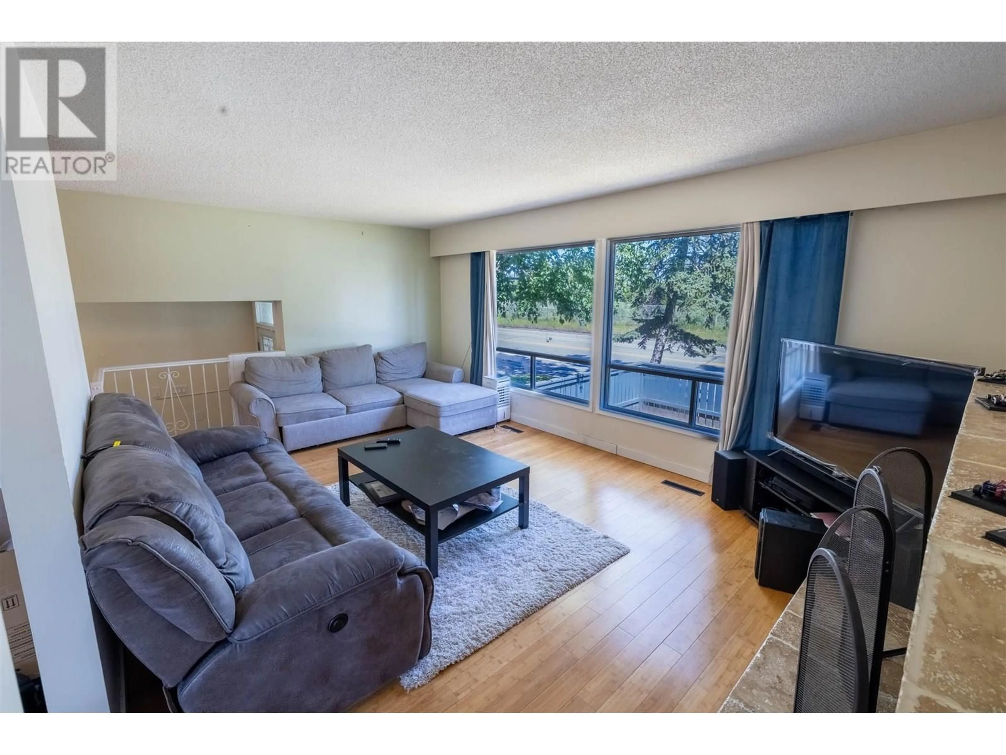Living room with furniture, wood/laminate floor for 2955 WESTWOOD DRIVE, Prince George British Columbia V2N1R7