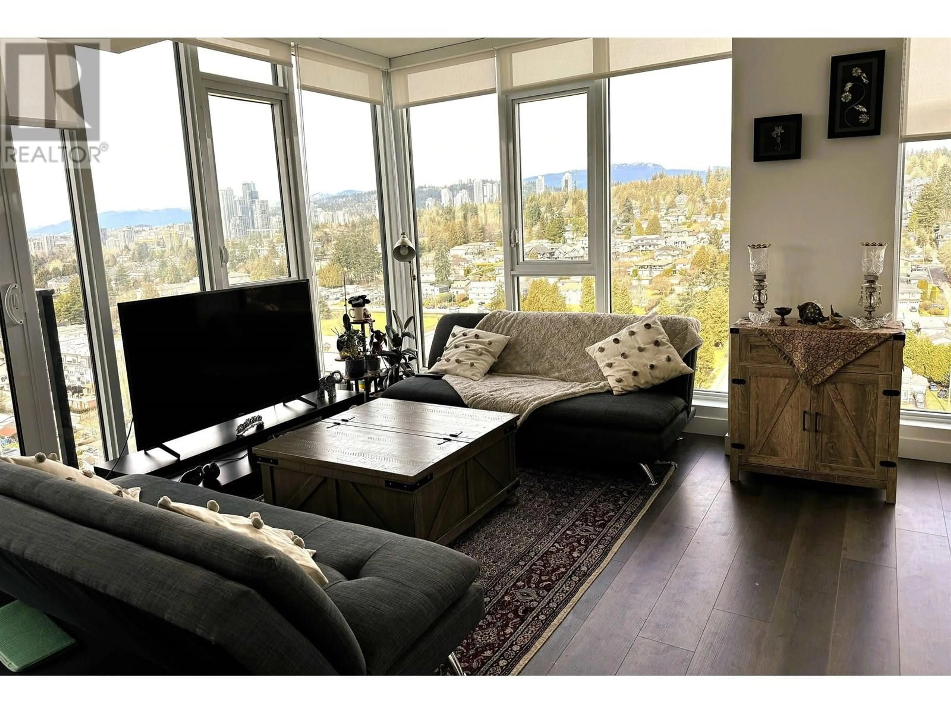 Living room with furniture, wood/laminate floor for 2303 - 901 LOUGHEED HIGHWAY, Coquitlam British Columbia V3K0J3