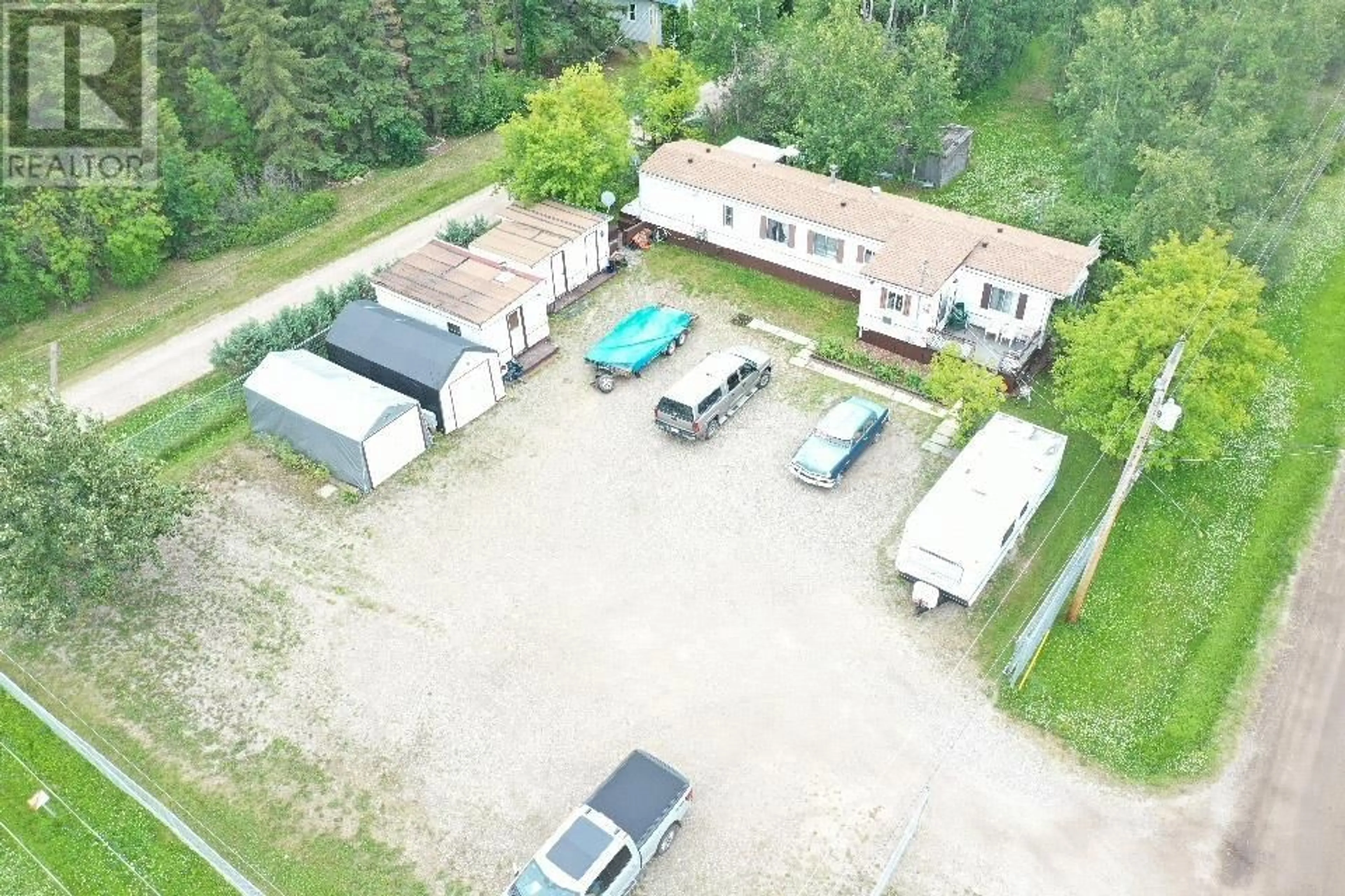 A pic from outside/outdoor area/front of a property/back of a property/a pic from drone, building for 9950 MAPLE STREET, Fort St. John British Columbia V1J4M6