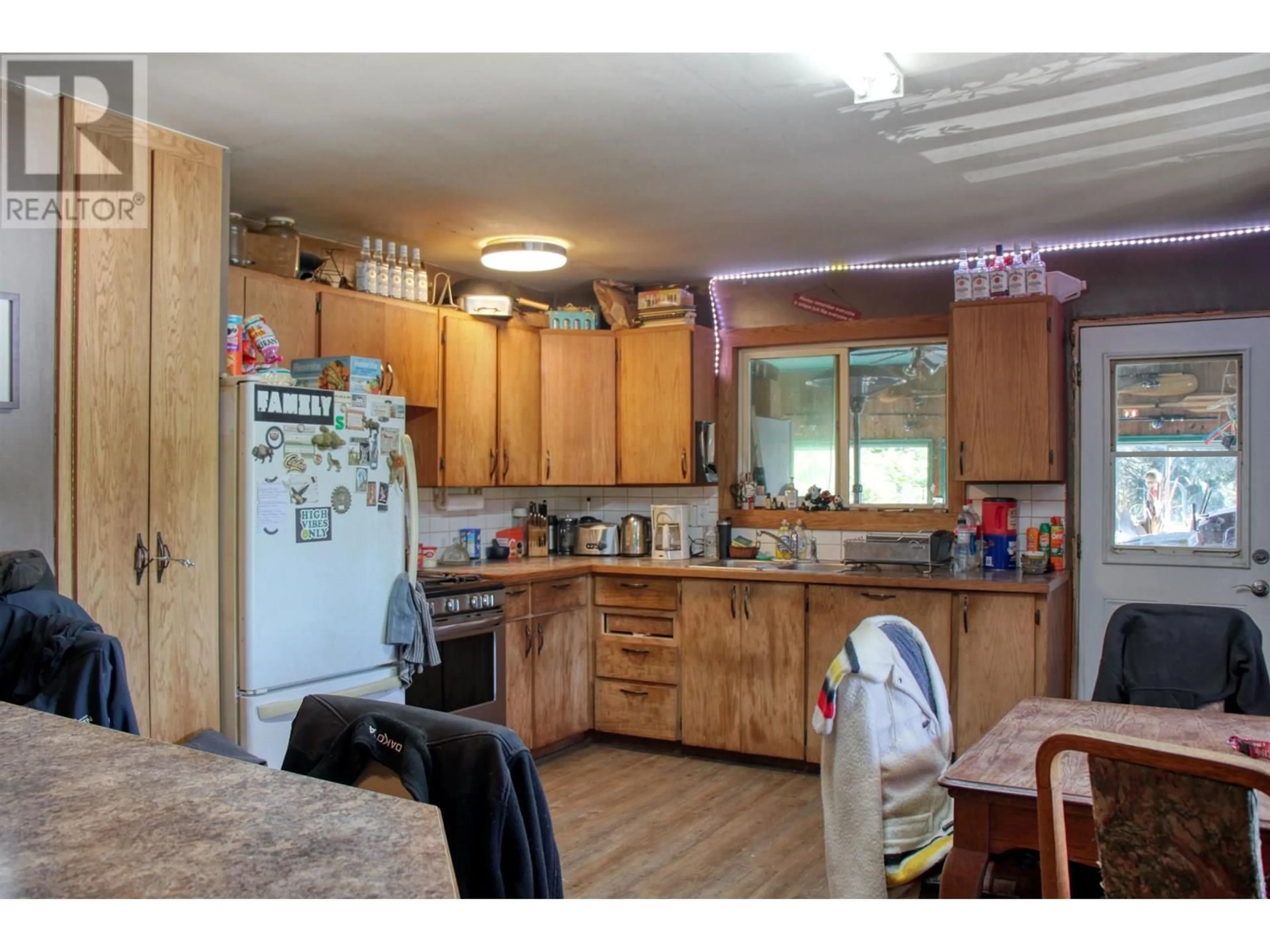 Standard kitchen, wood/laminate floor for 8245 BRIDGE LAKE NORTH ROAD, Bridge Lake British Columbia V0K1X2