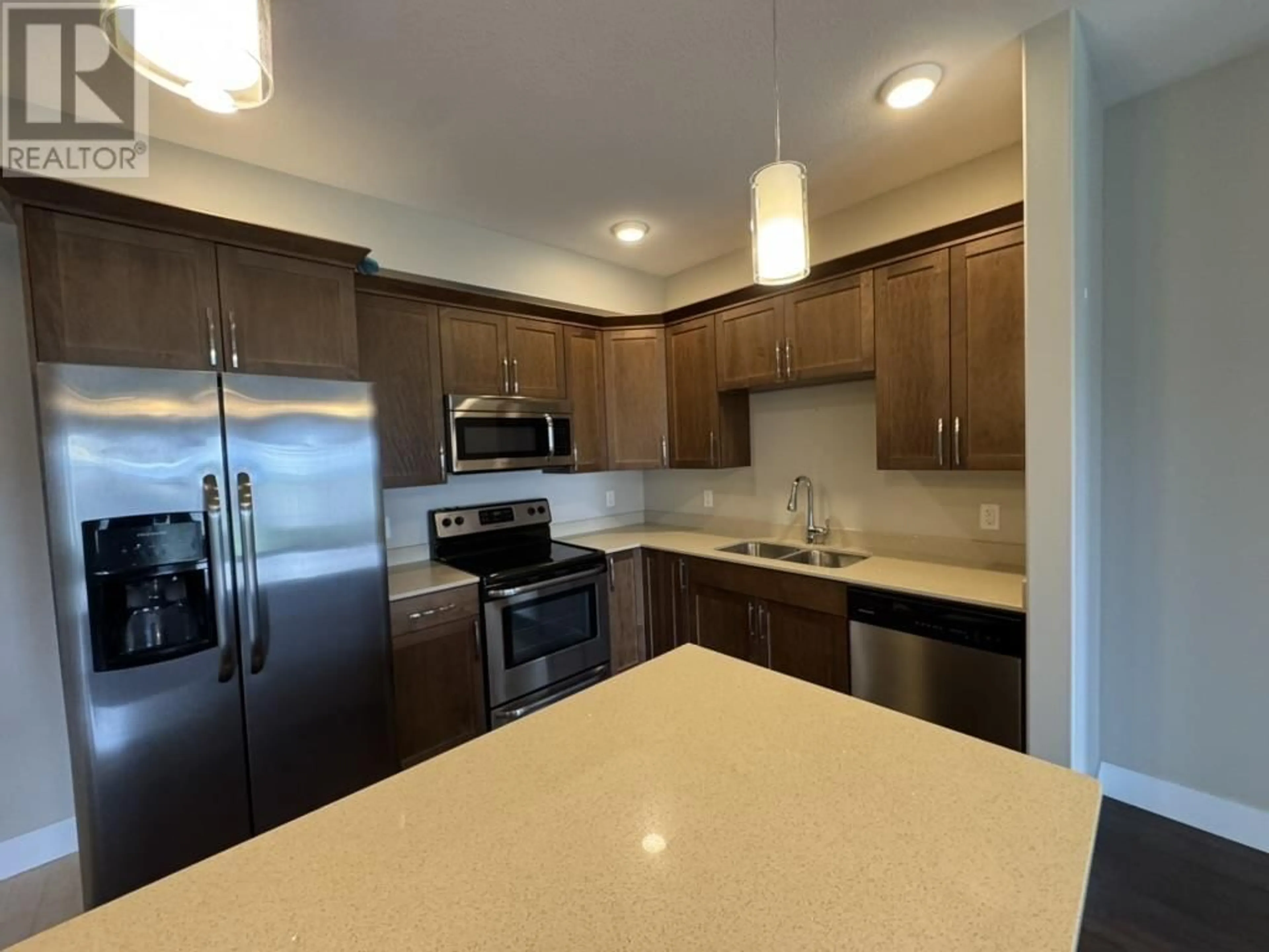 Open concept kitchen, unknown for 106 - 11205 105 AVENUE, Fort St. John British Columbia V1J0L3
