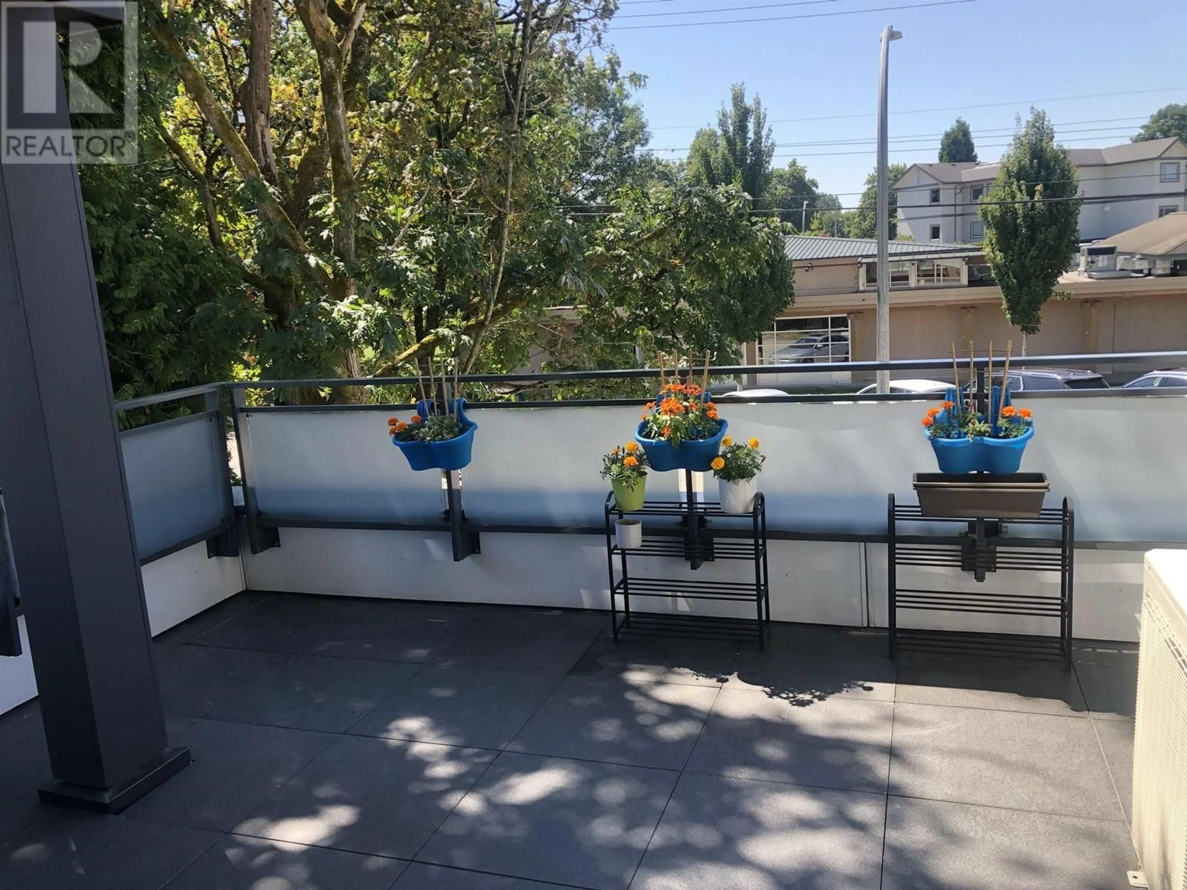 Patio, city buildings view from balcony for 107 - 4686 51 STREET, Delta British Columbia V4K2V7