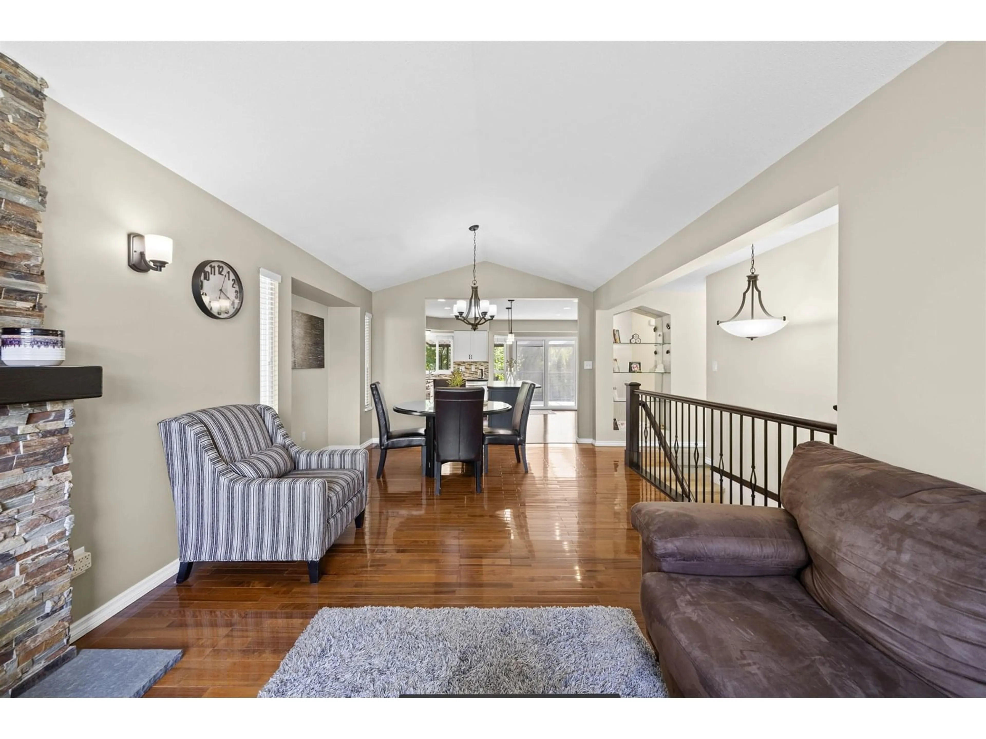 Living room with furniture, wood/laminate floor for 34776 1ST, Abbotsford British Columbia V2S8C2