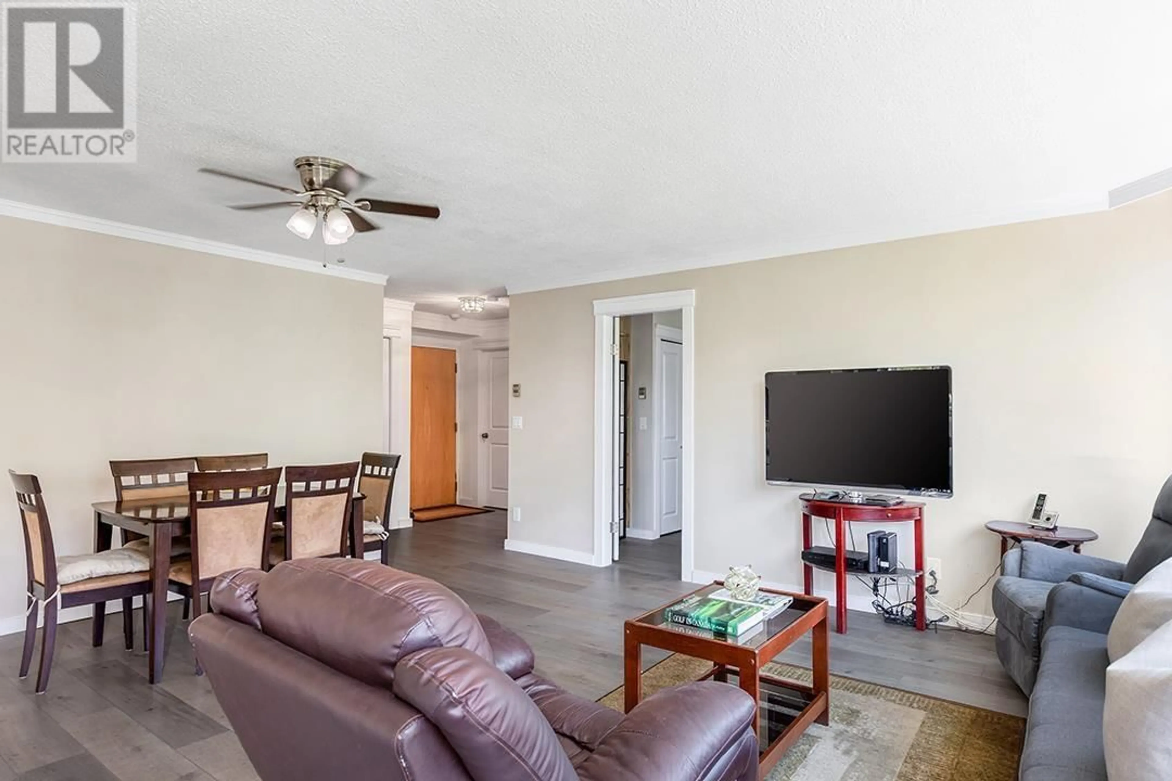 Living room with furniture, wood/laminate floor for 402 - 7321 HALIFAX STREET, Burnaby British Columbia V5A4R5