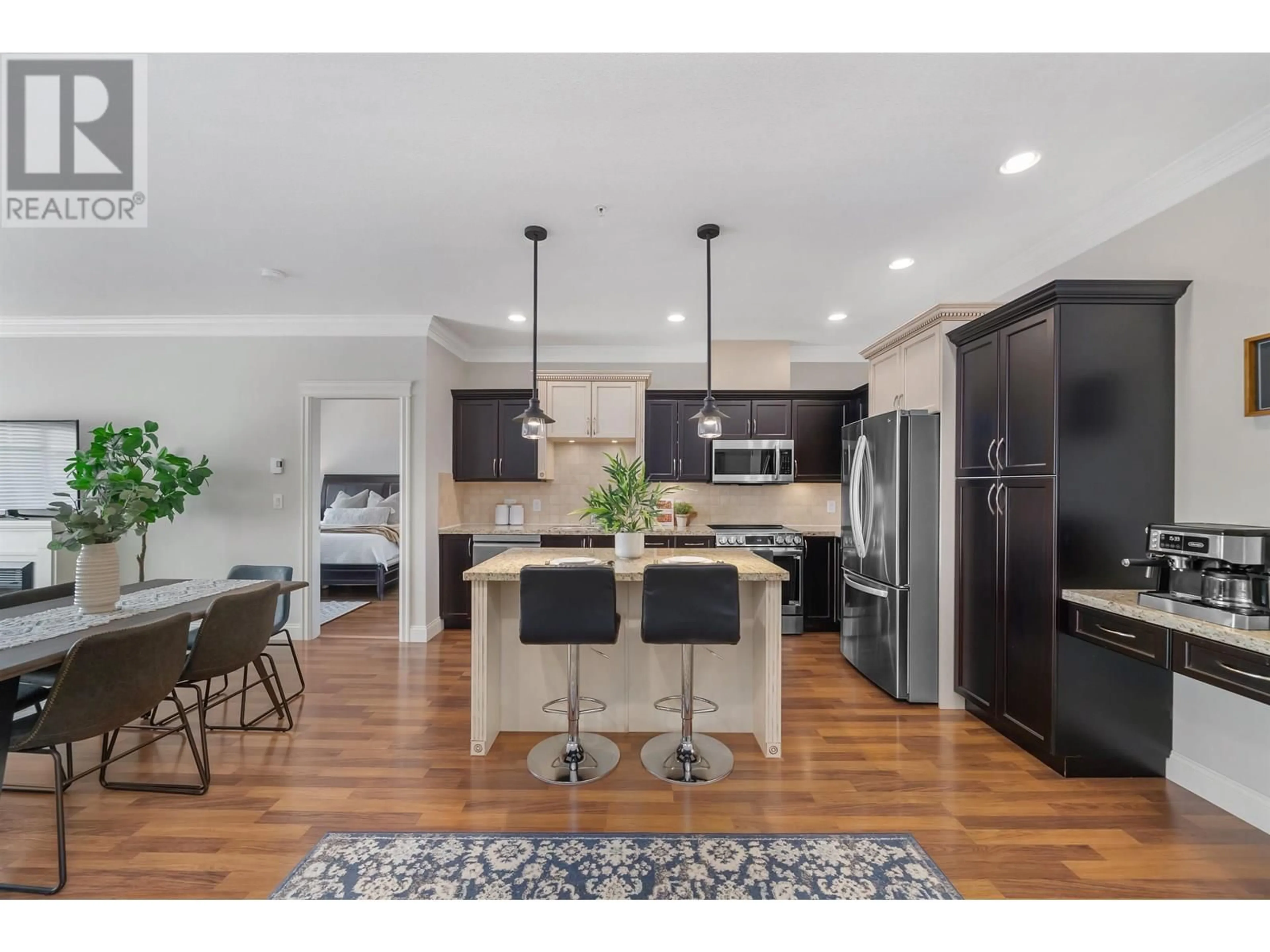 Open concept kitchen, wood/laminate floor for 309 - 22150 DEWDNEY TRUNK ROAD, Maple Ridge British Columbia V2X3H6